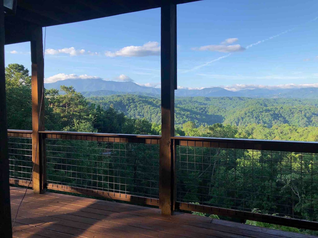 The lower level 3 sided deck has immense views of the Smokies.