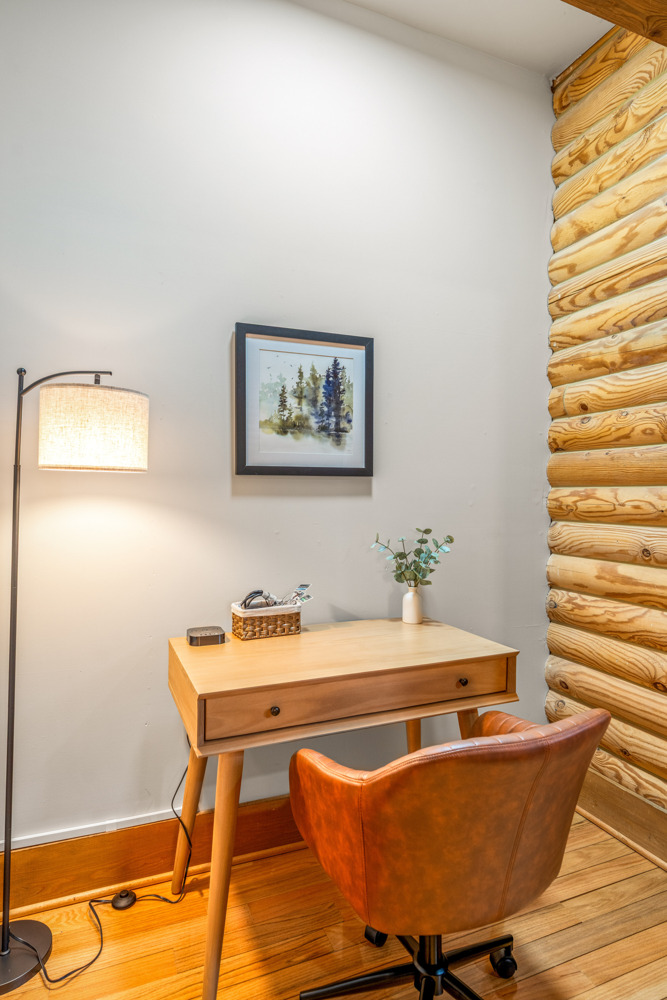 Dedicated workspace with desk and chair perfect for remote work, Zoom calls, or quick check-ins (WiFi included).