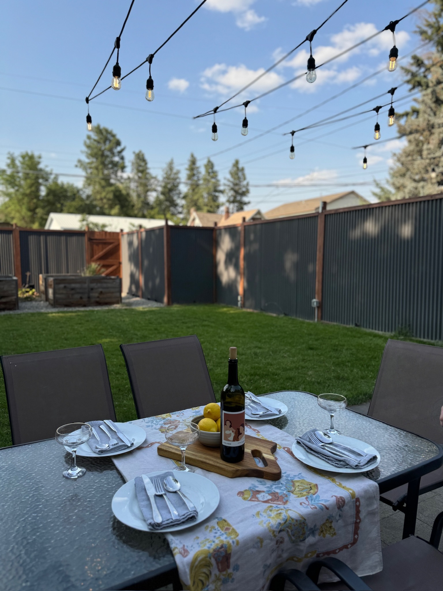 Enjoy dining outdoors on the patio in the fully fenced backyard. Then soak in the hot tub for maximum relaxation!

Guests are encouraged to create their own patio dining experience! Please note: the photographed wine is not included in your stay :) 