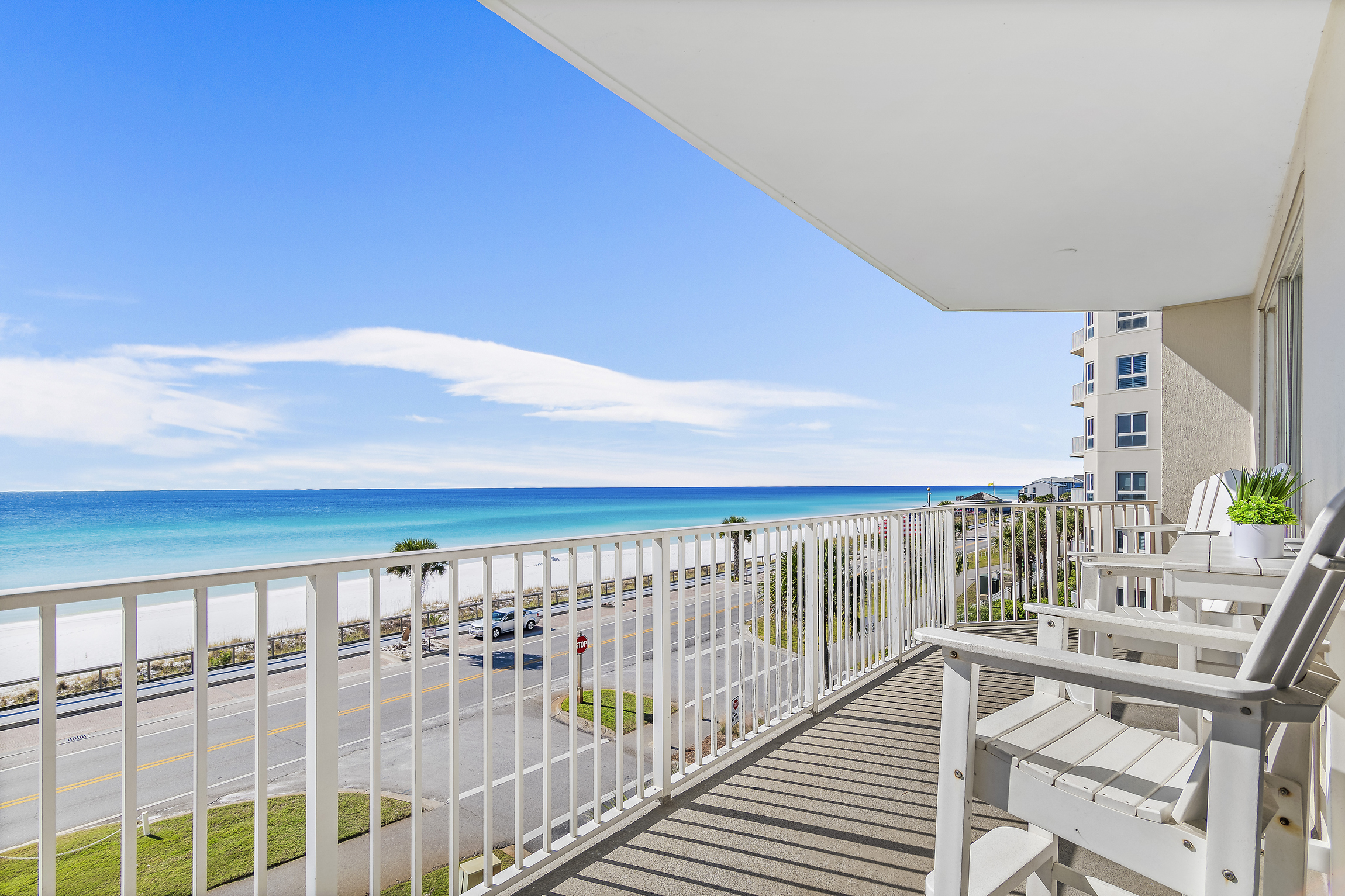 Spacious patio with plenty of seating, perfect for soaking in those Emerald Coast Views - accessible from the living room AND Master bedroom
