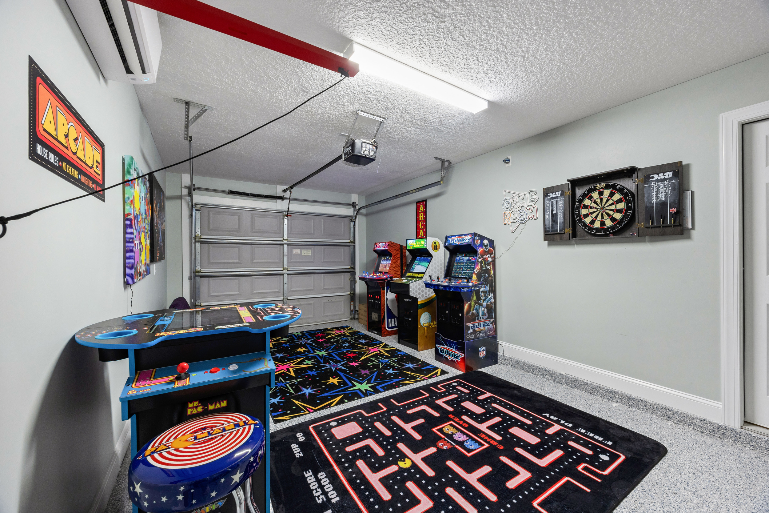 Game room with arcade machines and seating