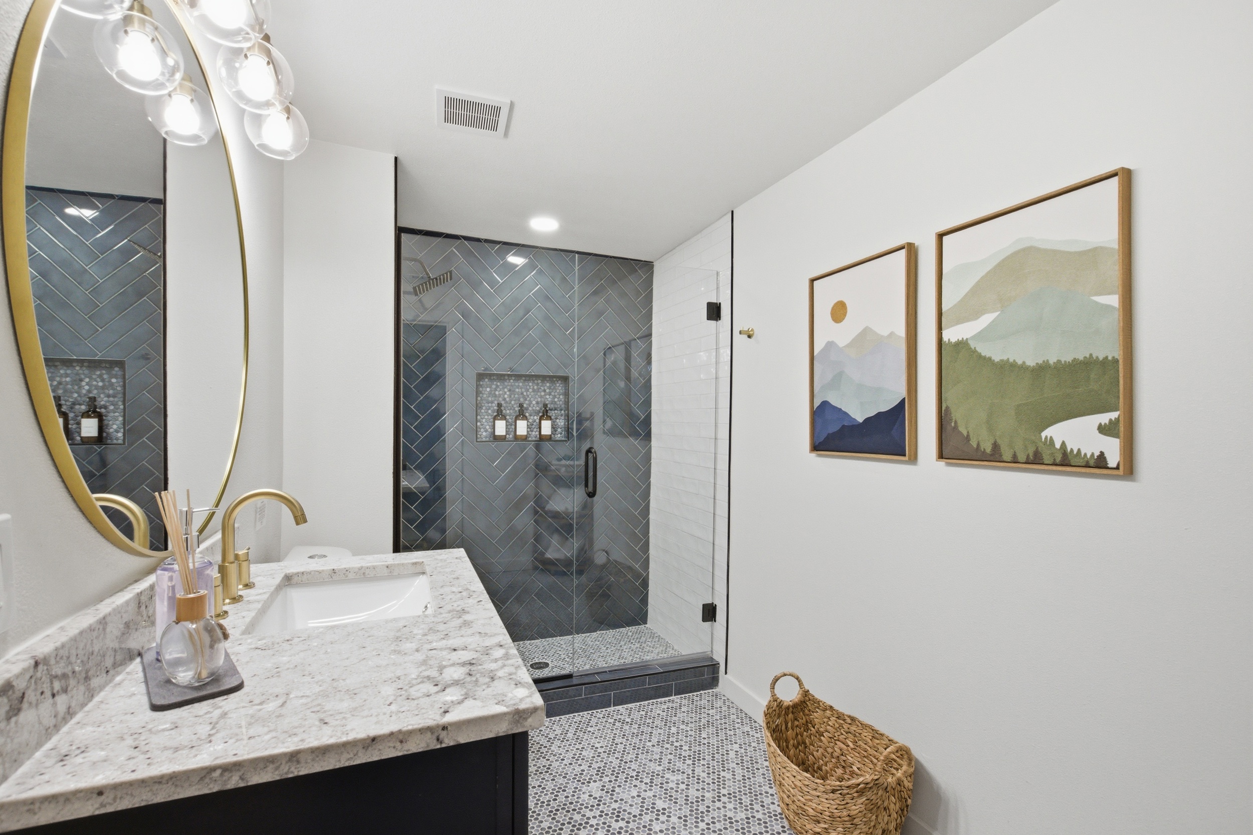 Master ensuite with standing shower, gold fixtures, and marble vanity. Hairdryer included. Stocked with shampoo, conditioner, and shower gel by Ginger Lily Farms. 10-min walk to AT&T Stadium.