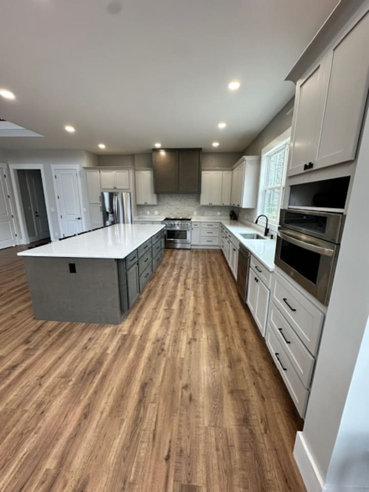 Island seats 5 with an additional two stools in the dining area. Kitchen table upgrade coming soon to accommodate even more guests. Plenty of pantry space, kitchen appliances, dishes, mugs, etc. 