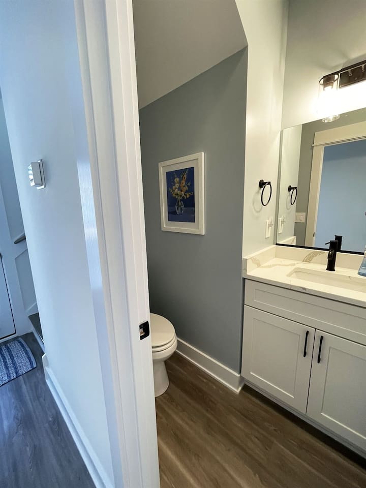 Stylish and easily accessible half bathroom, perfect for added convenience during your stay.