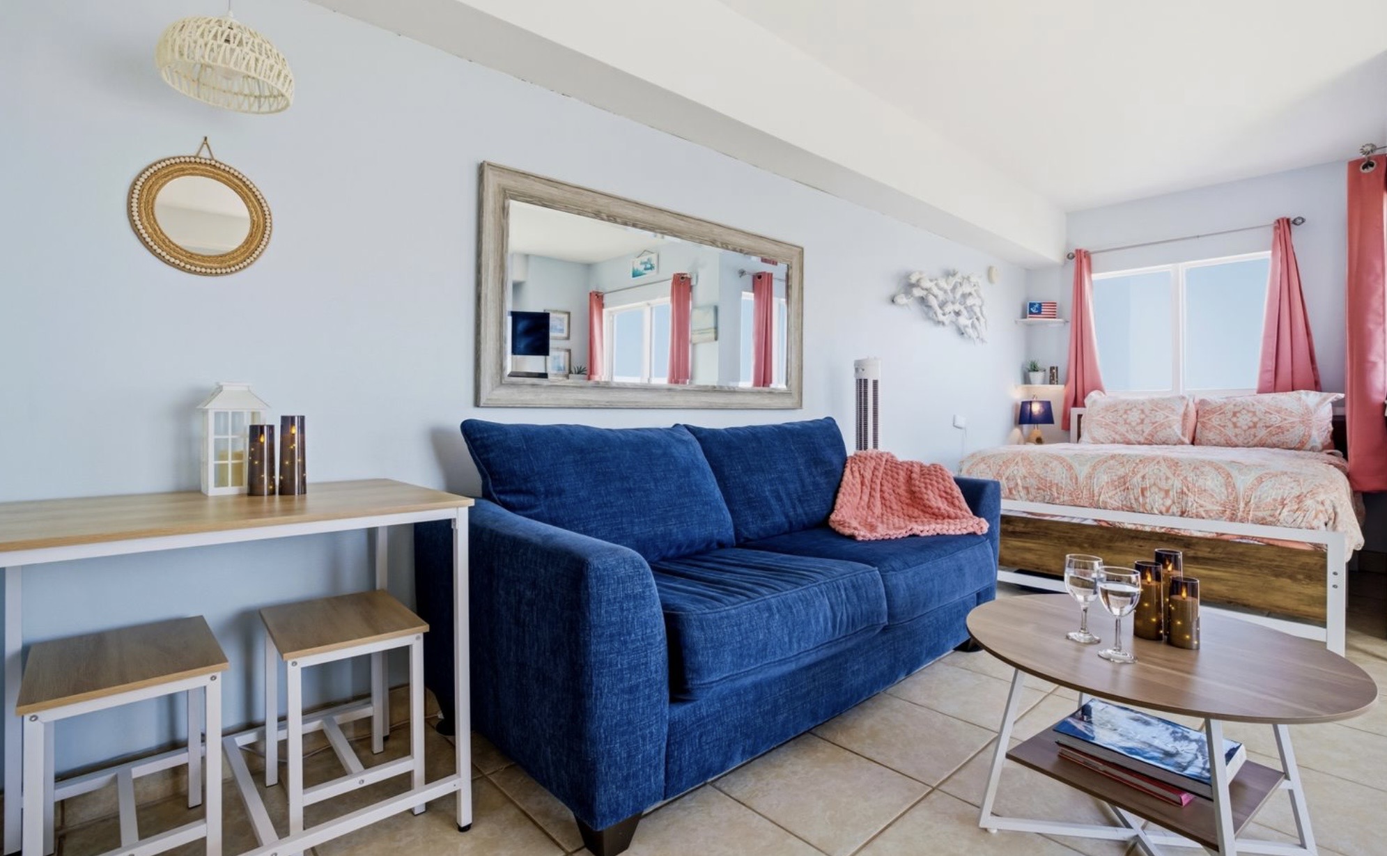 A calm, welcoming living space styled with soft coastal tones and natural light. Simple, elevated, and intentionally designed for rest, comfort, and connection. ⭐