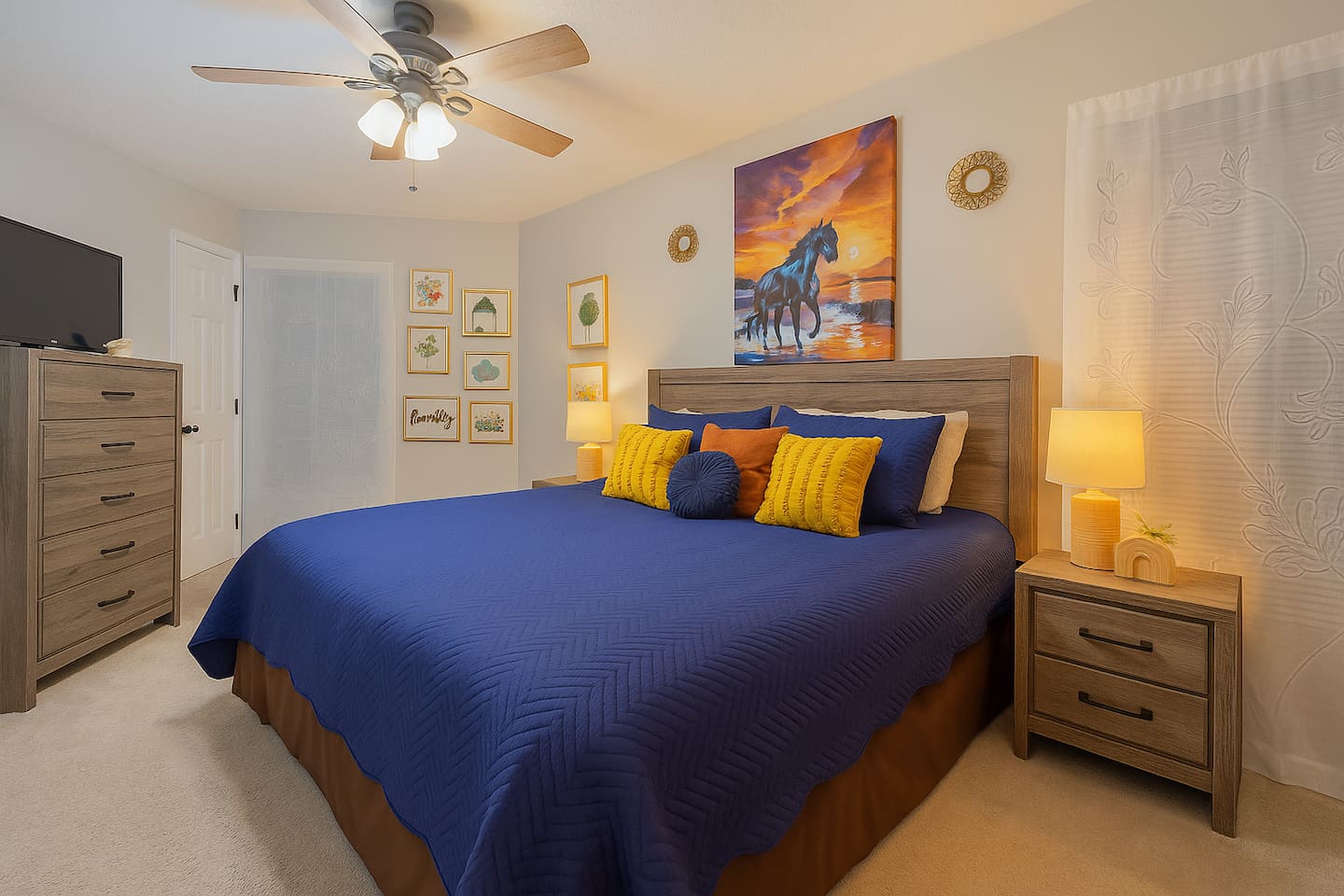 Relax in this spacious king bedroom with soft lighting and beach-inspired art — your peaceful retreat after a busy day.