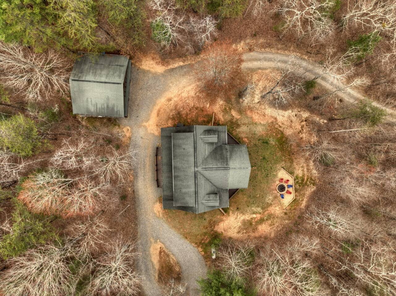 Capture a bird's-eye view of the house from above using a drone