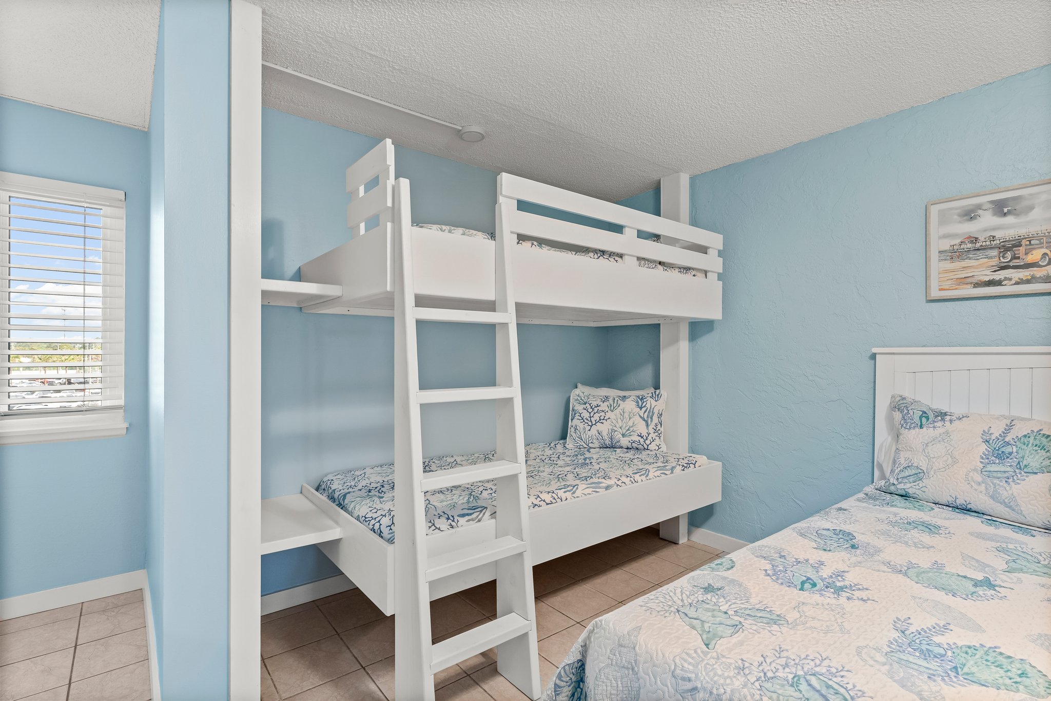 shelf and power outlets for each bunk bed to recharge phones and laptops