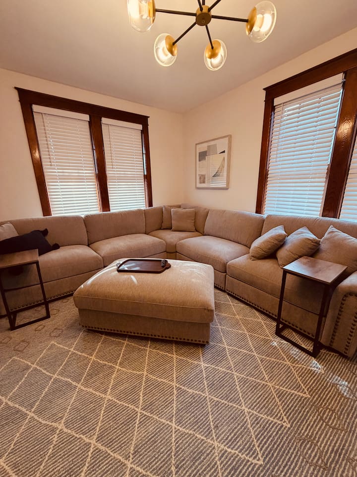 Comfortable living room with smart TV and plenty of seating for your group