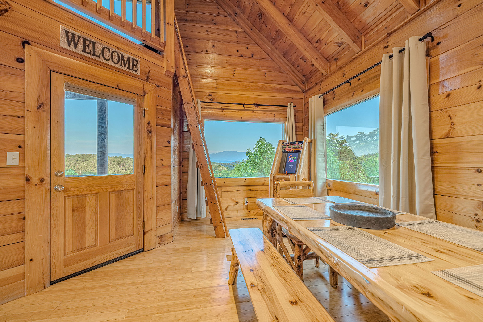 Pull up a seat and take in the beauty! Our dining table is surrounded by windows, offering breathtaking views with every bite.
