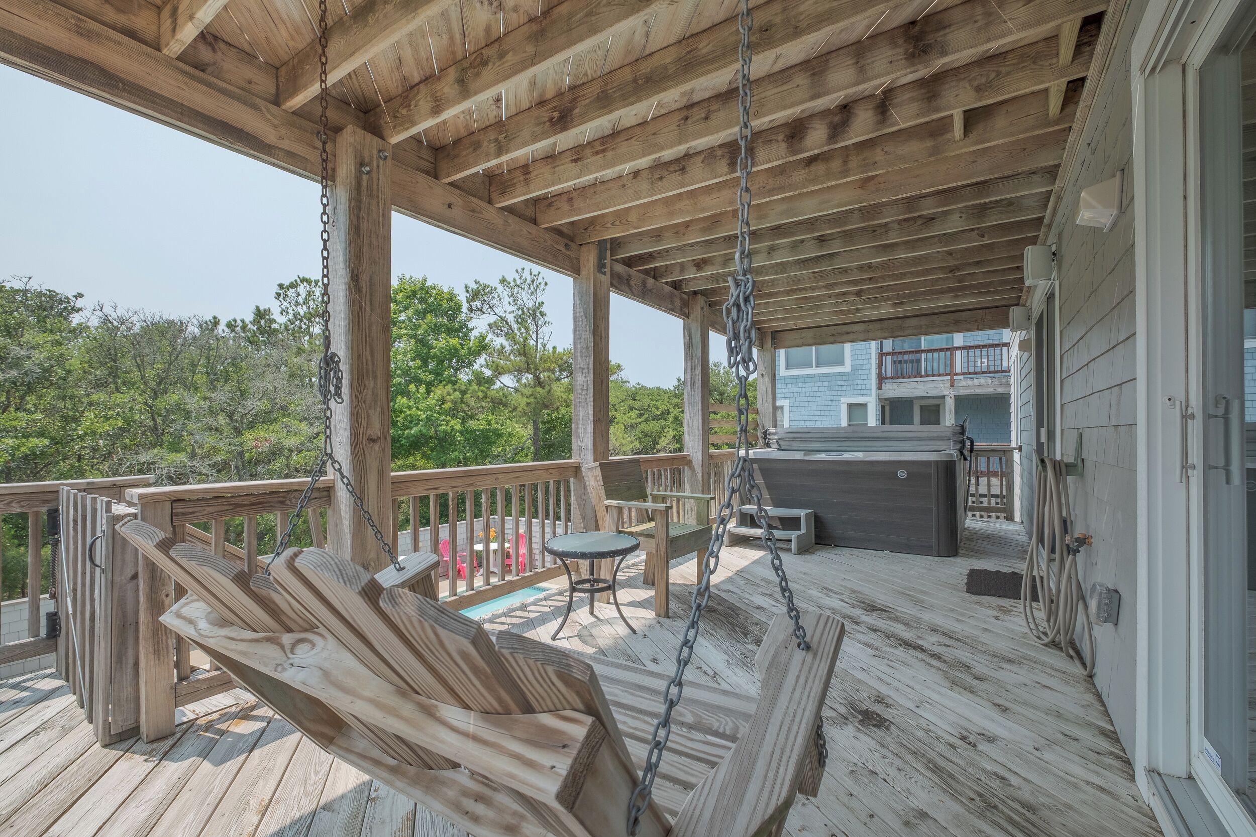Covered deck with a swing and Hot Tub!