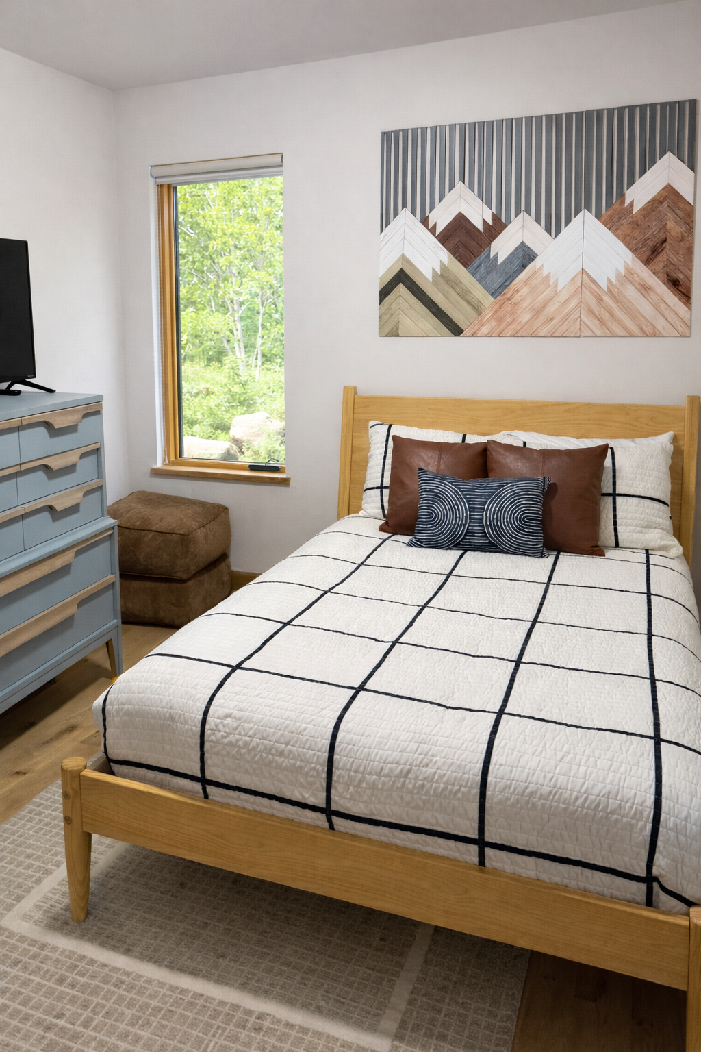 Second-floor full bed with clean, modern styling