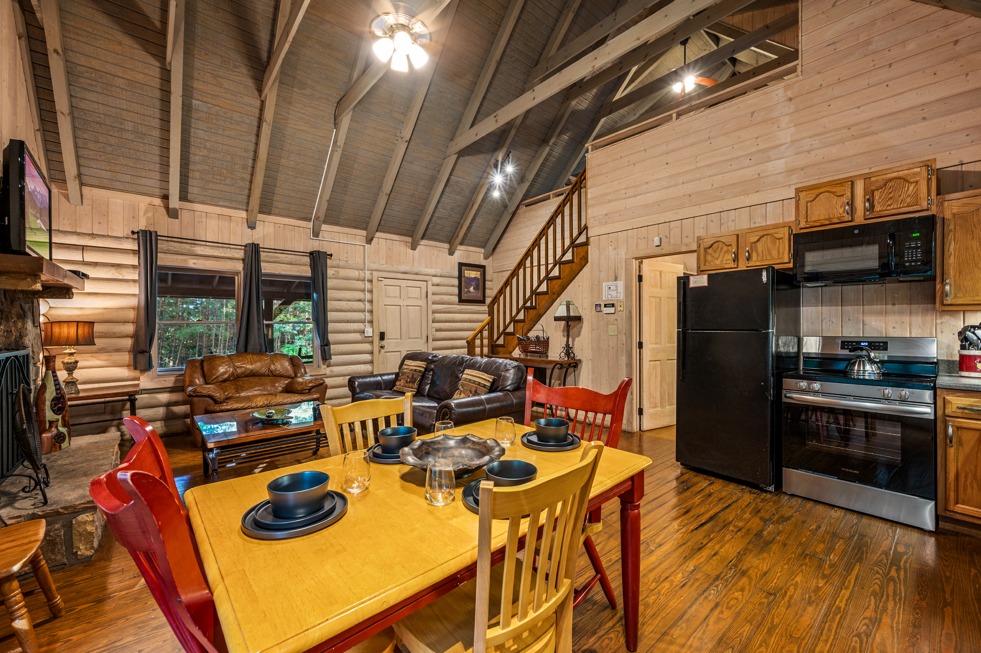 Gather here! Open-concept kitchen, dining, & living with fireplace.