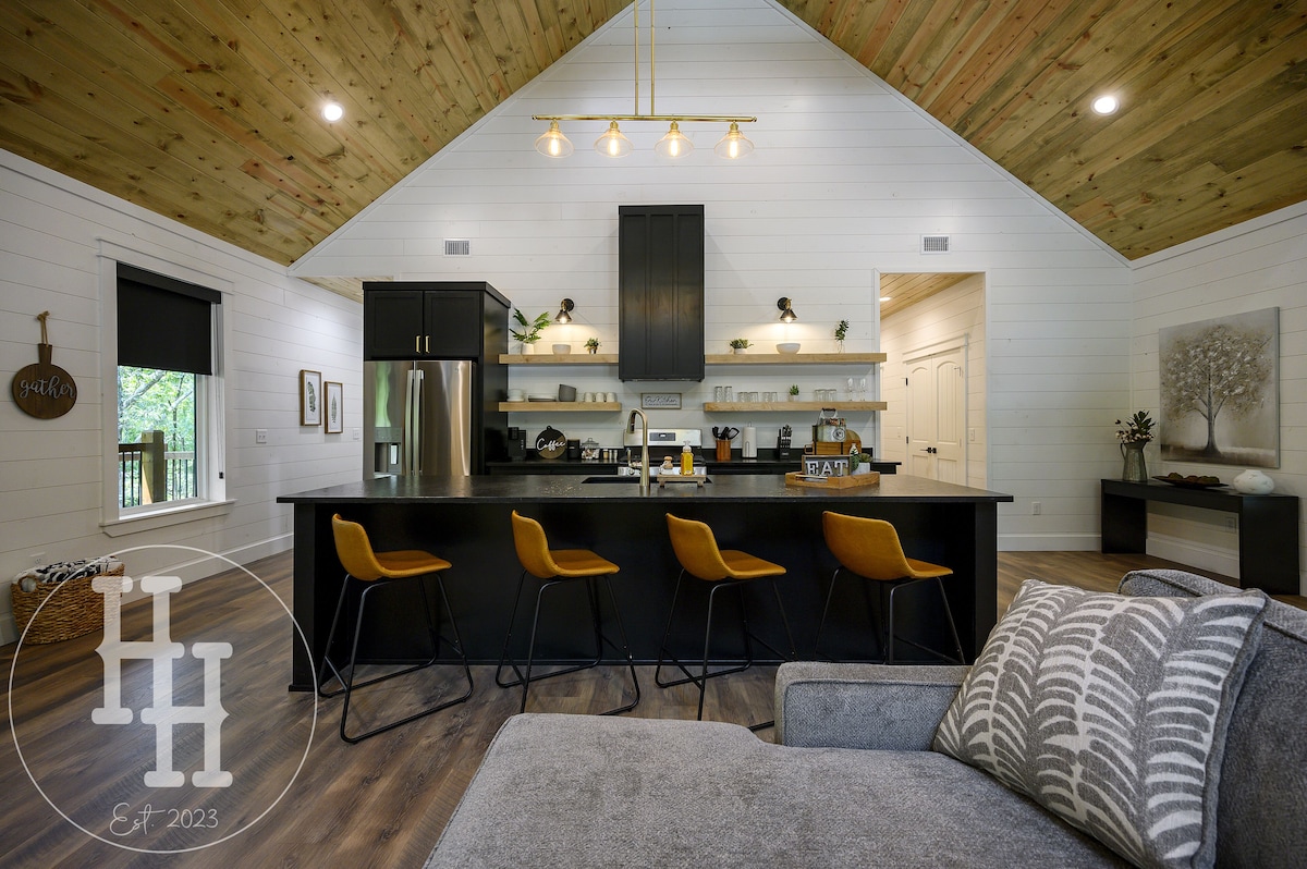 Our large island is complete with a sink and four bar stools. 