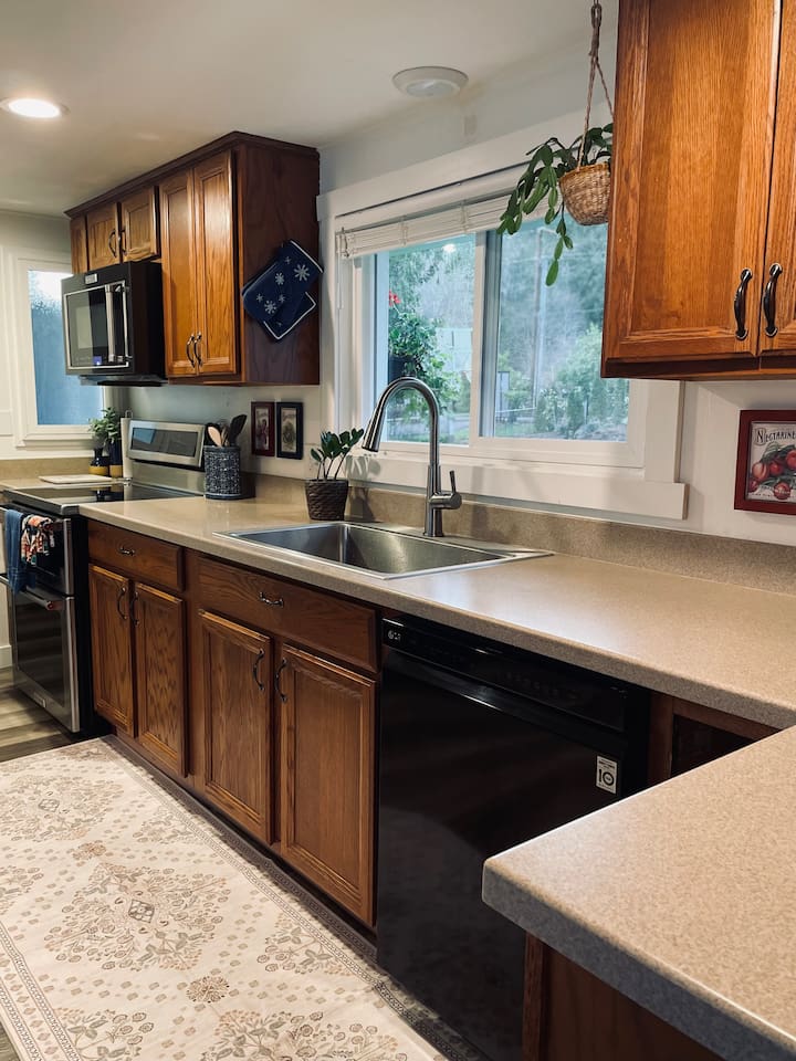 A functional kitchen with clean lines and thoughtful details, perfect for preparing meals and gathering around.