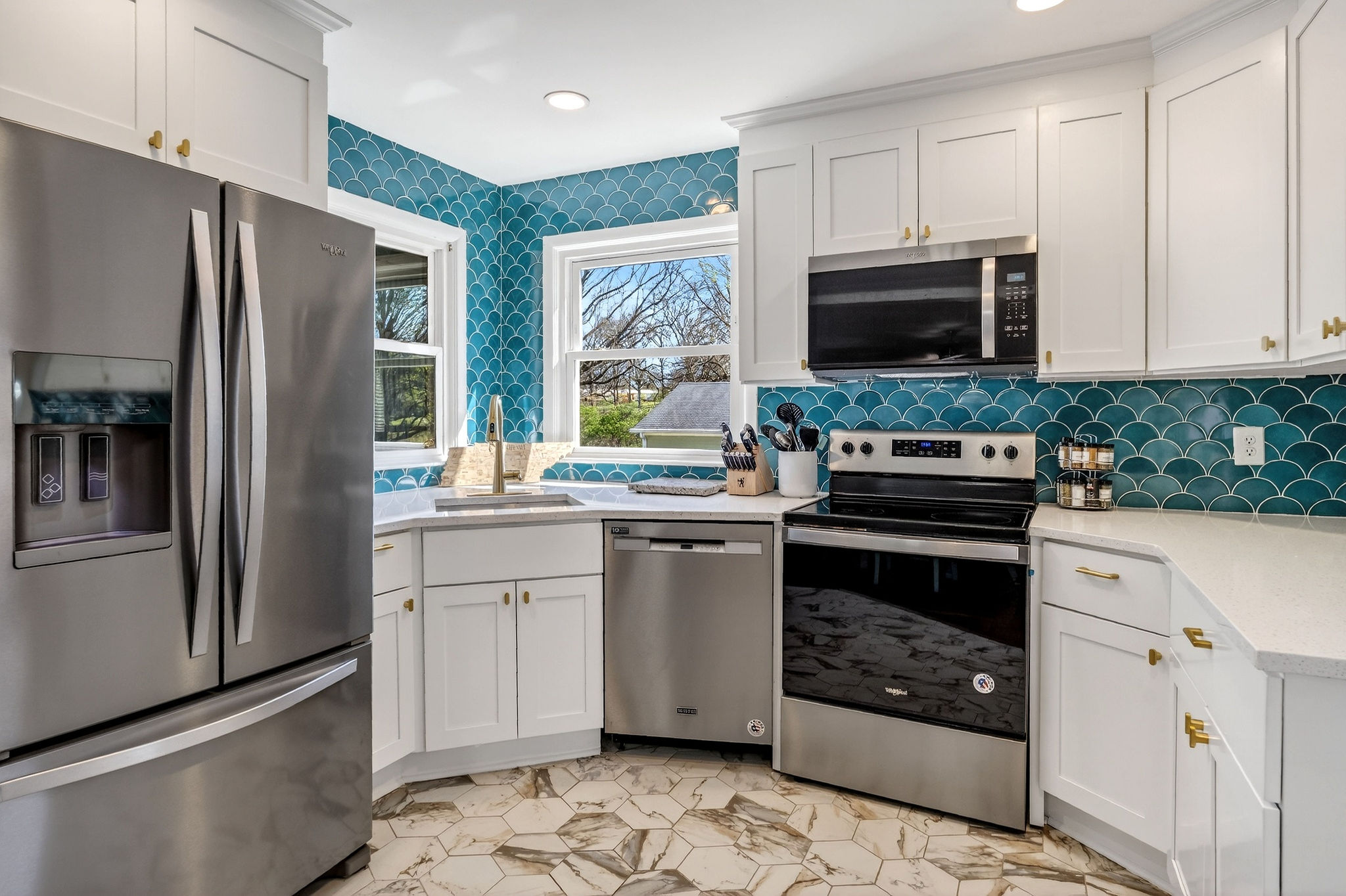 Trendy touches in this historic Ranch! Did you spot the mermaid tile?