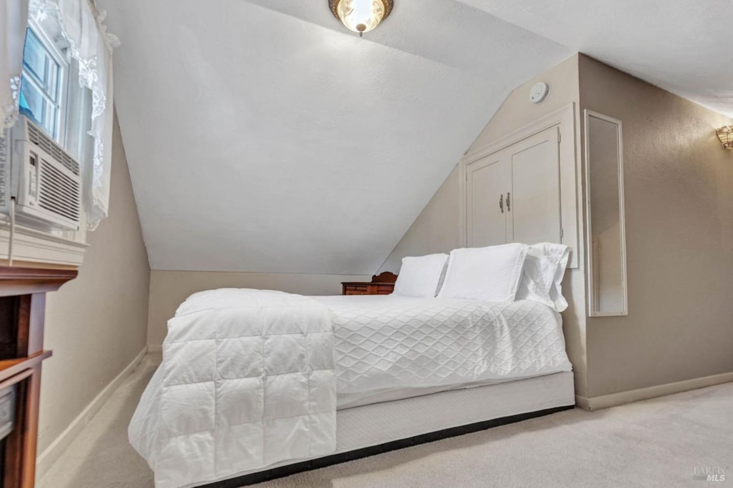 Fifth bedroom on second floor with queen bed.
