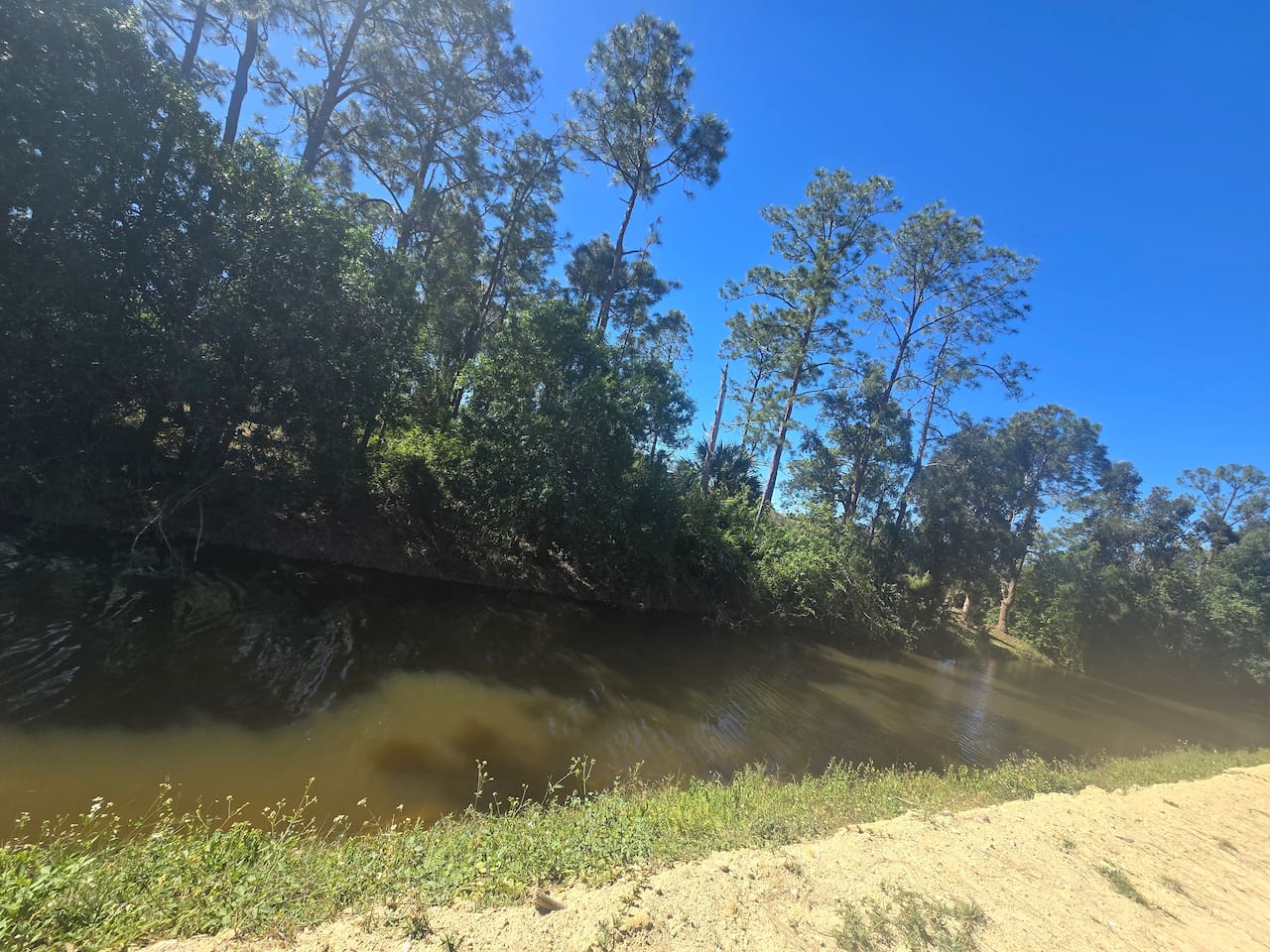 Canal views just beyond the fenced backyard — your peaceful Florida escape.