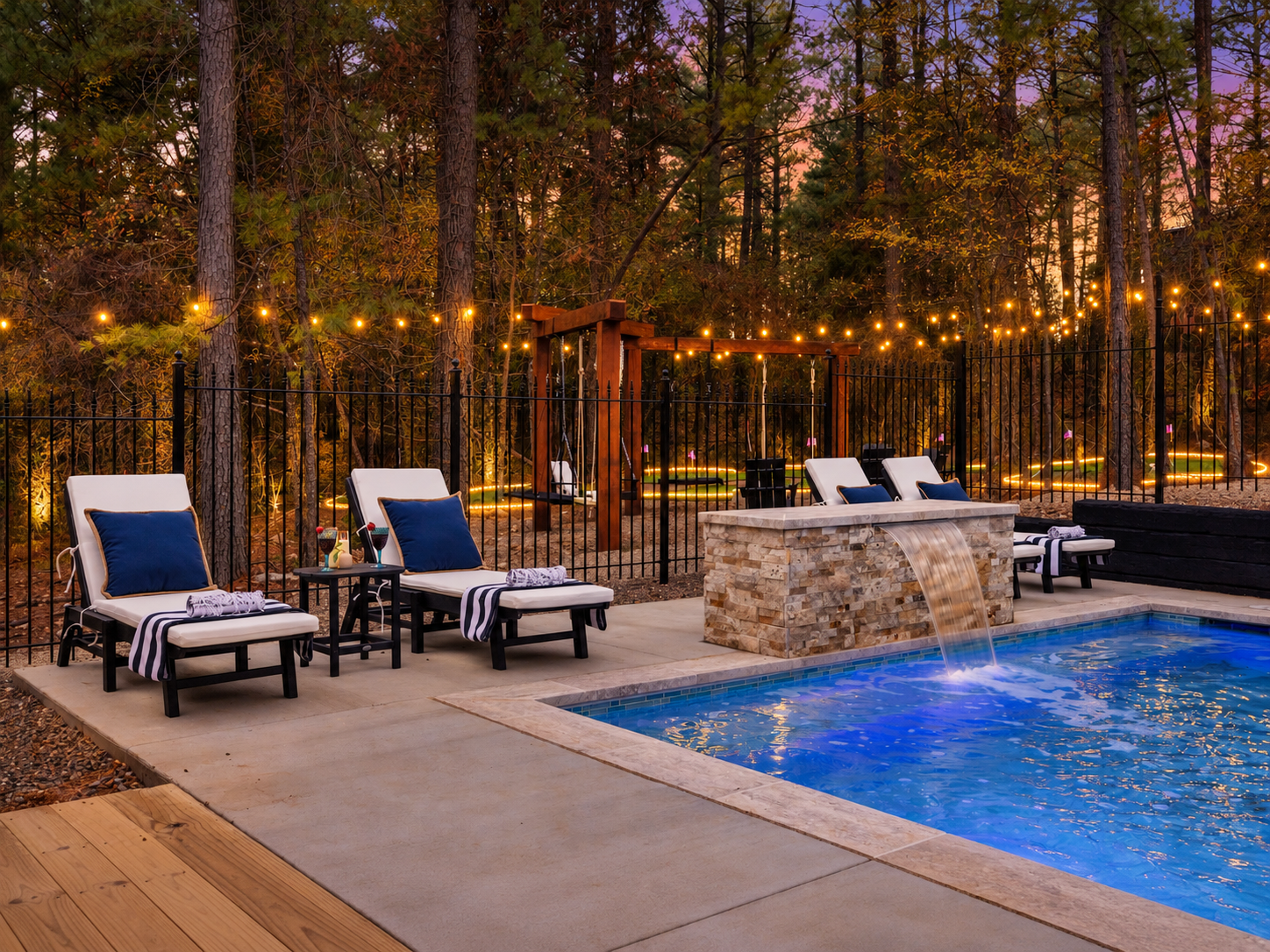 💦 Poolside bliss, anyone? Sip, soak, and settle in on the cozy loungers while the waterfall fountain sets the vibe while taking in the string lights and views. ✨