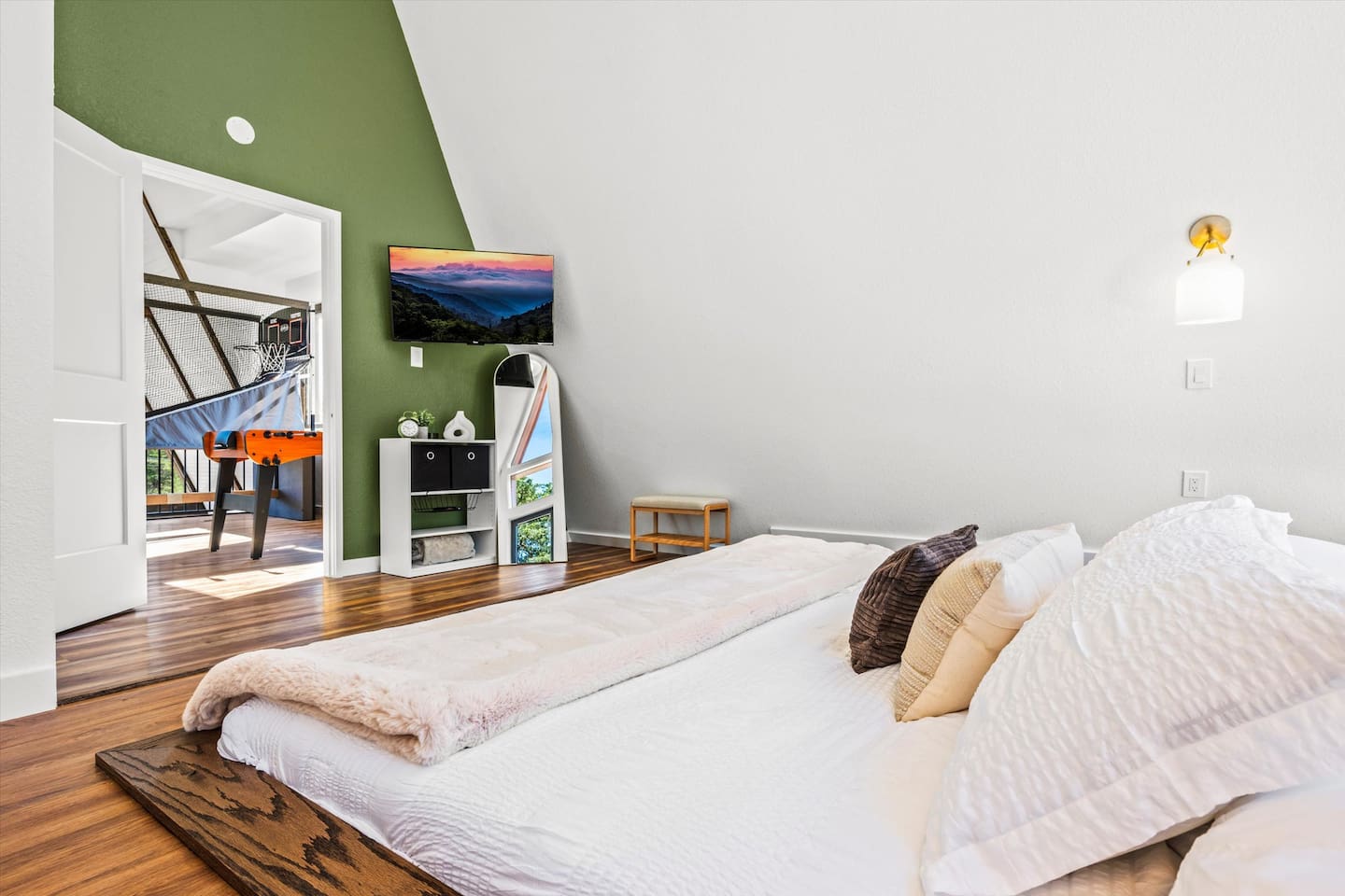 Cozy up under crisp sheets in this calm and modern bedroom.