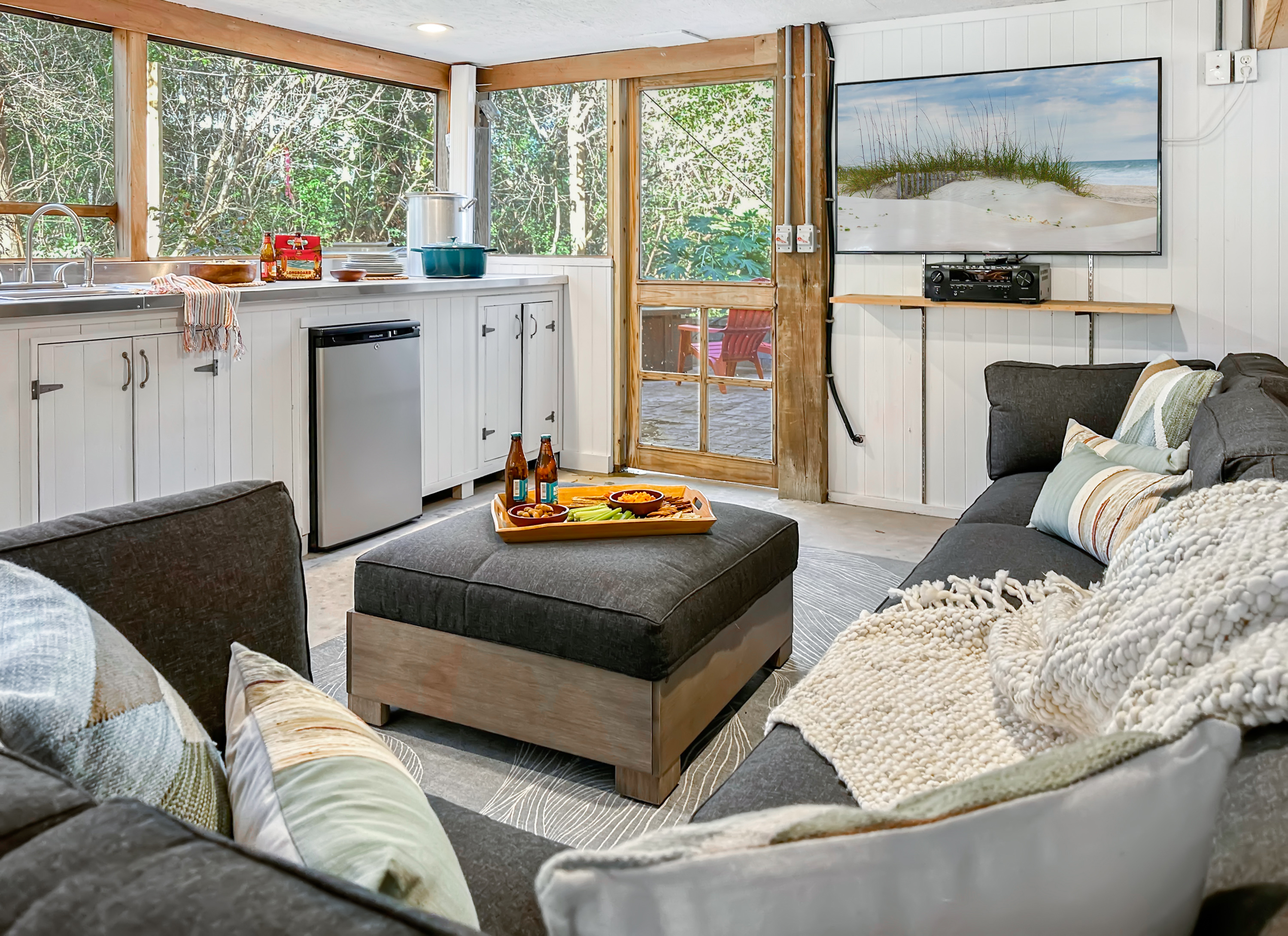 There's an outdoor screened dining area with its own kitchenette and TV lounge.