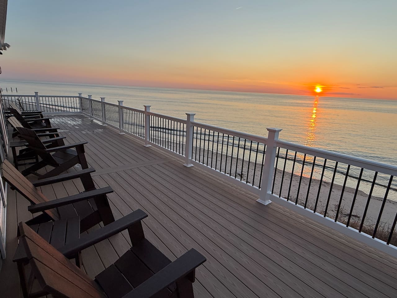 Unwind on the expansive private deck, which provides an ideal setting to enjoy a beautiful sunset over the ocean. The deck is equipped with comfortable lounge chairs, making it a perfect spot for relaxation.