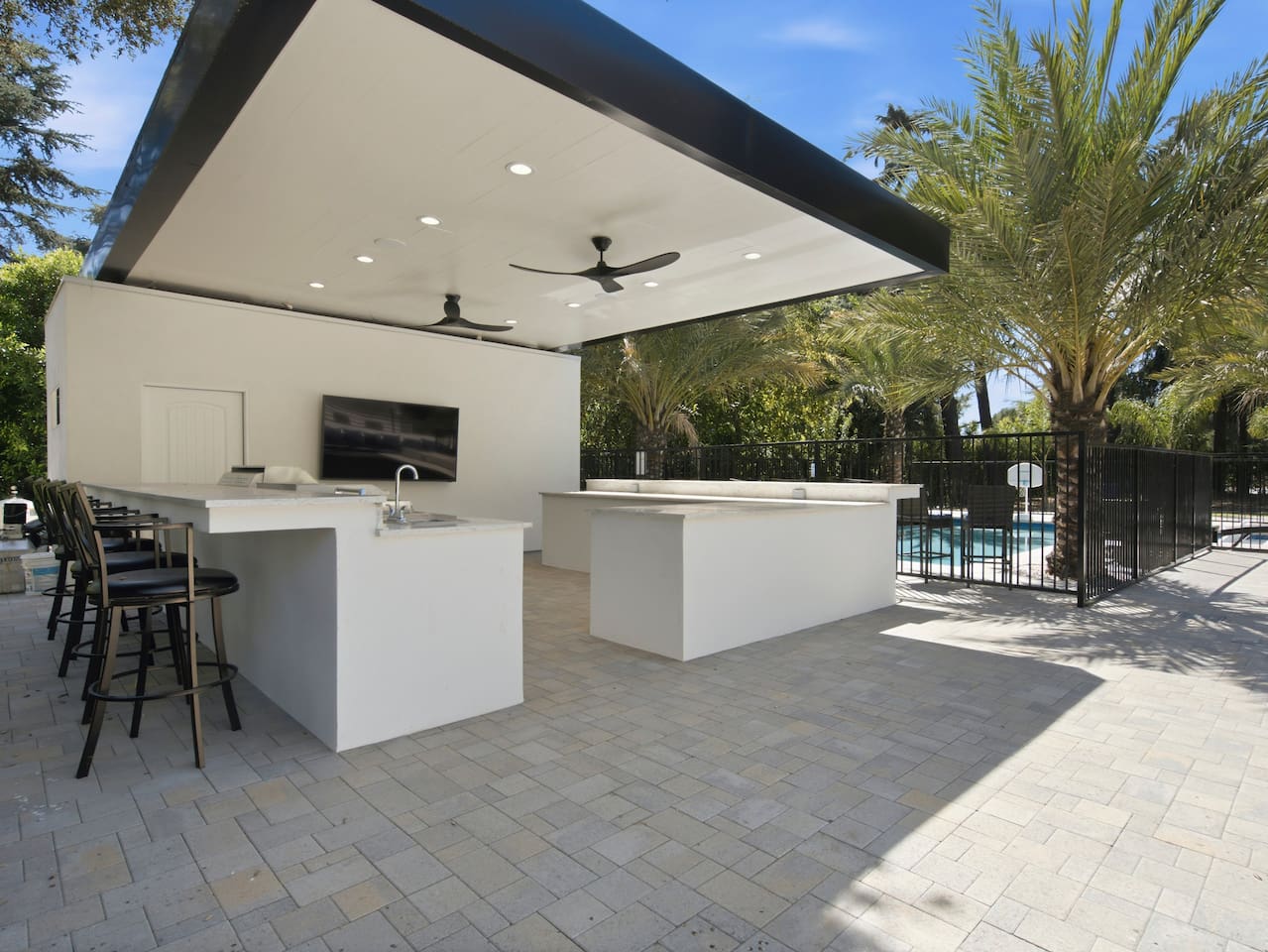 Opens directly into the bright dining space, offering ample seating and peaceful views of the outdoors.