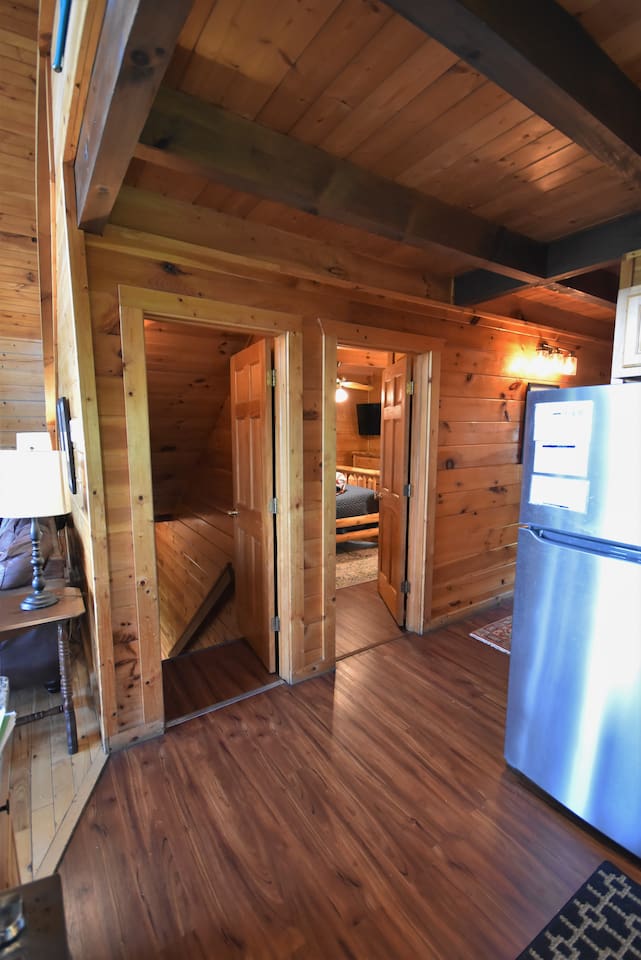 Access to the main floor bedroom and stairs to the lower level from the entry hallway / kitchen area. 