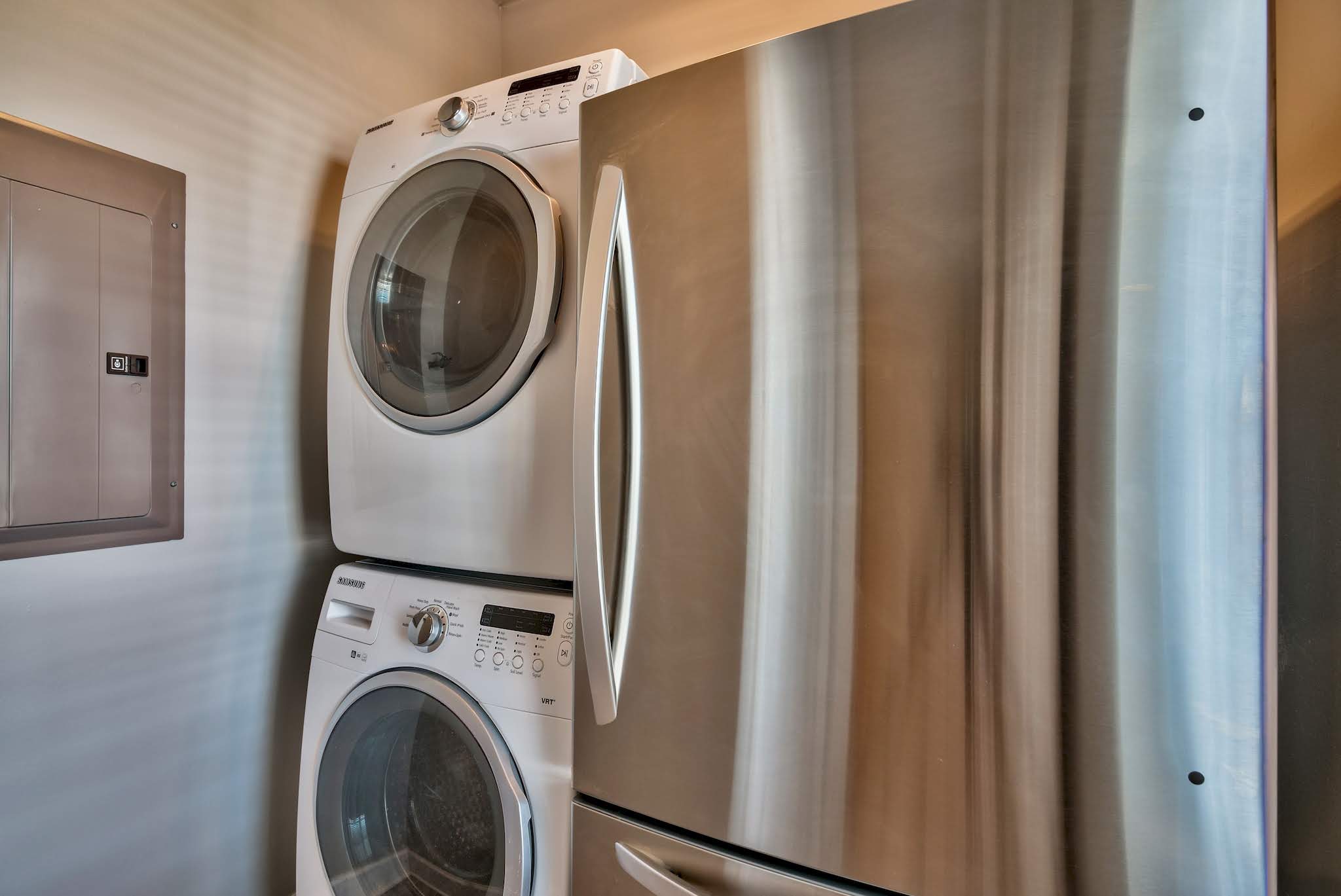 Laundry room with full-size fridge