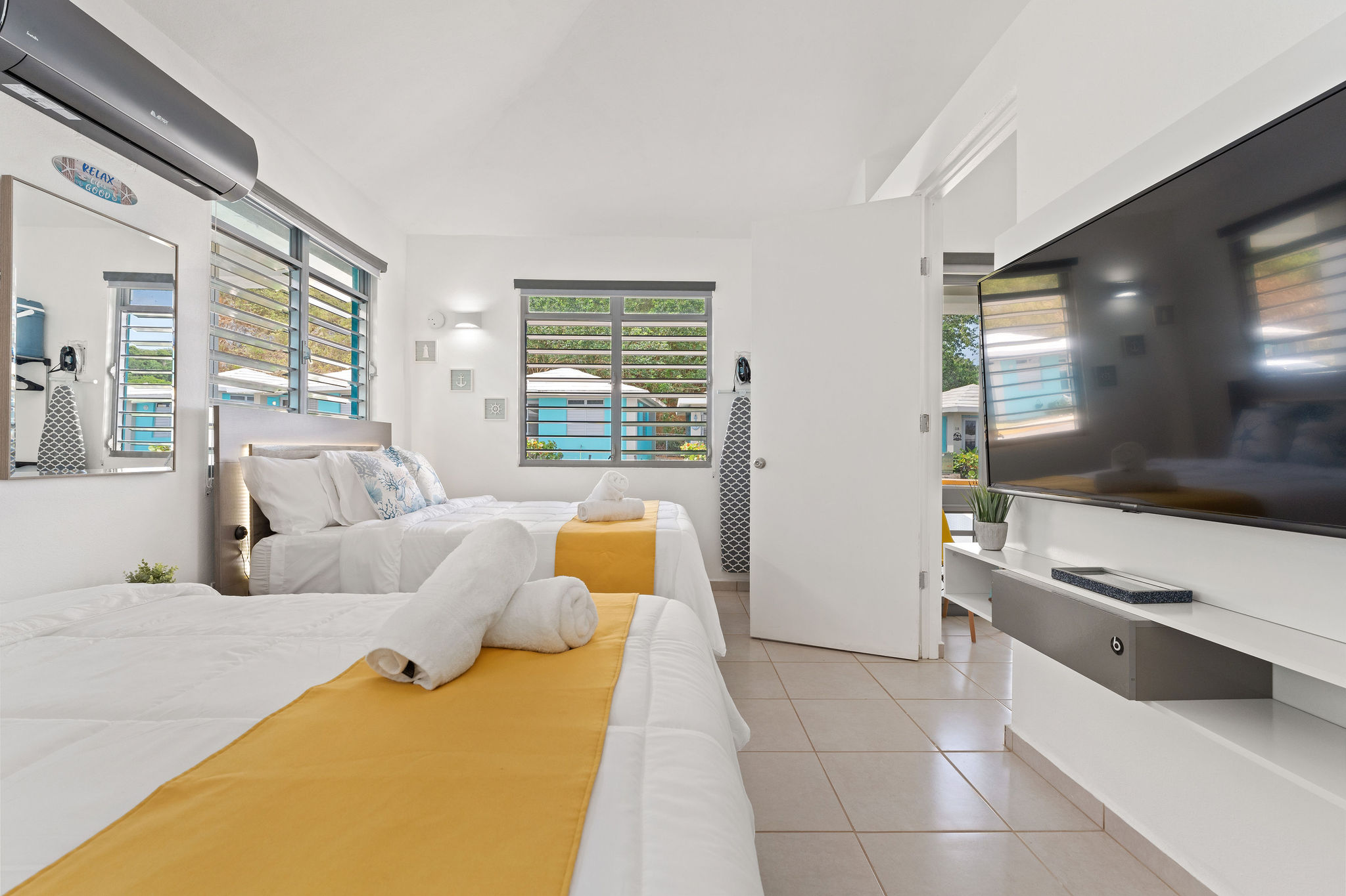 Queen beds and TV in the bedroom