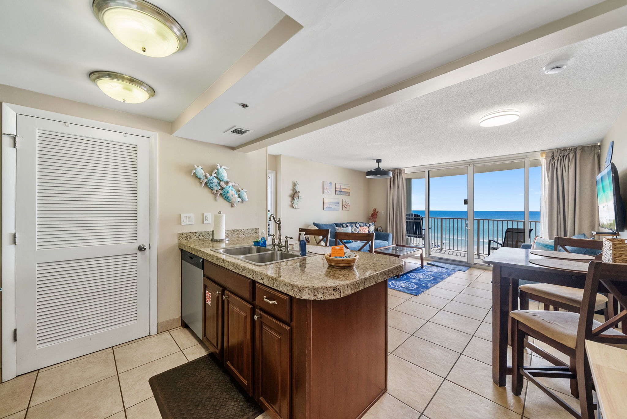 Open floorplan and beach views from kitchen, living and dining room