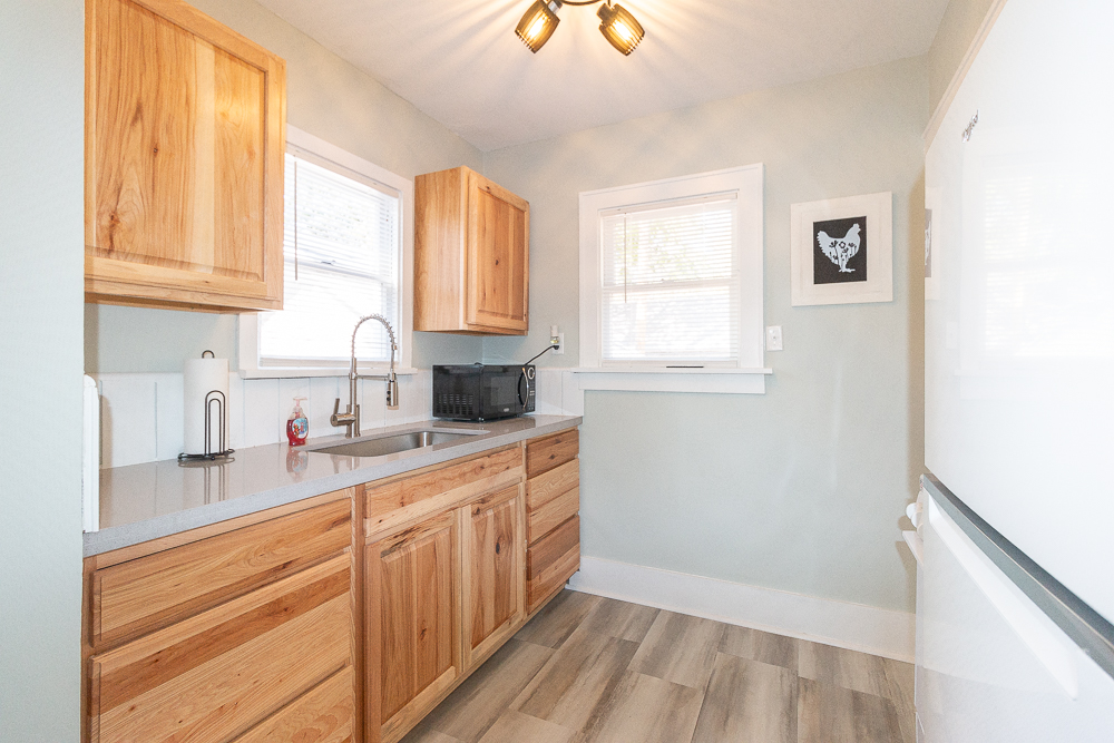 A thoughtfully designed kitchen featuring ample counter space and essential cookware.