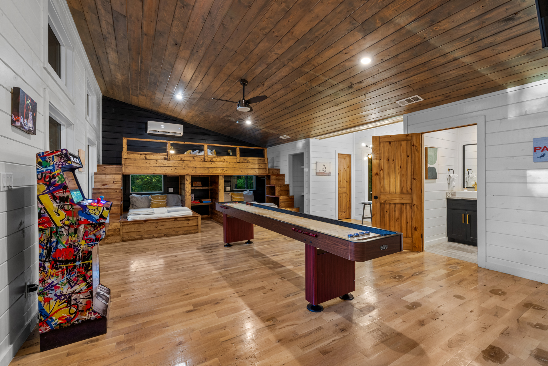 A game area featuring over 100 arcade games and a shuffleboard table — perfect for endless entertainment, friendly competition, and group fun indoors. 🎮🏓✨