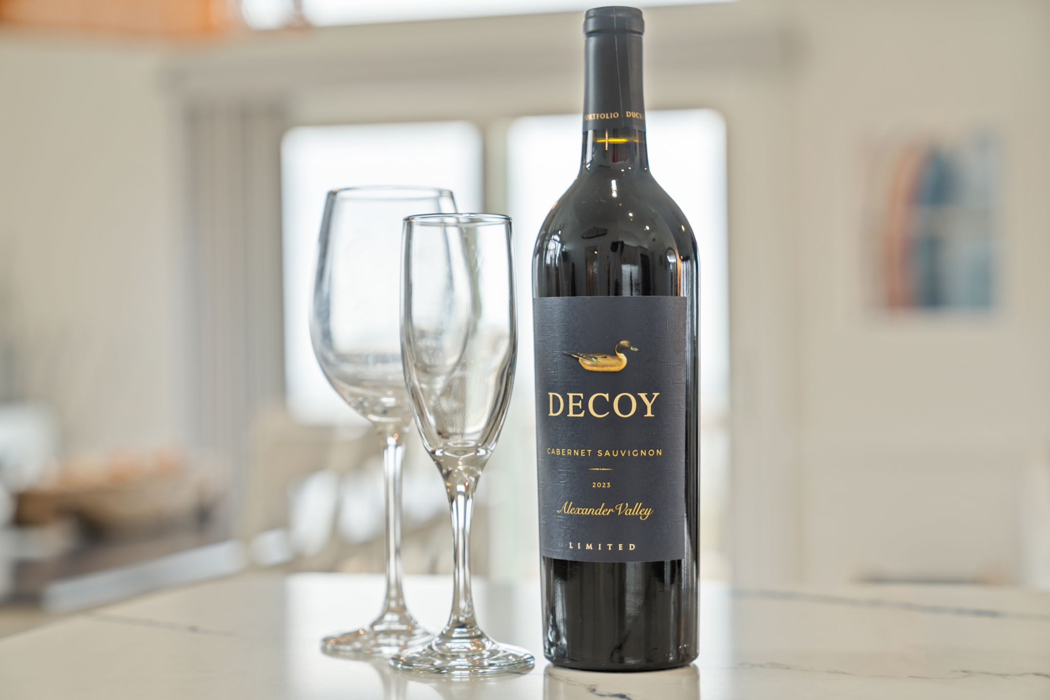 Small dining or bar setup with wine and glassware, nice for a quiet evening in.