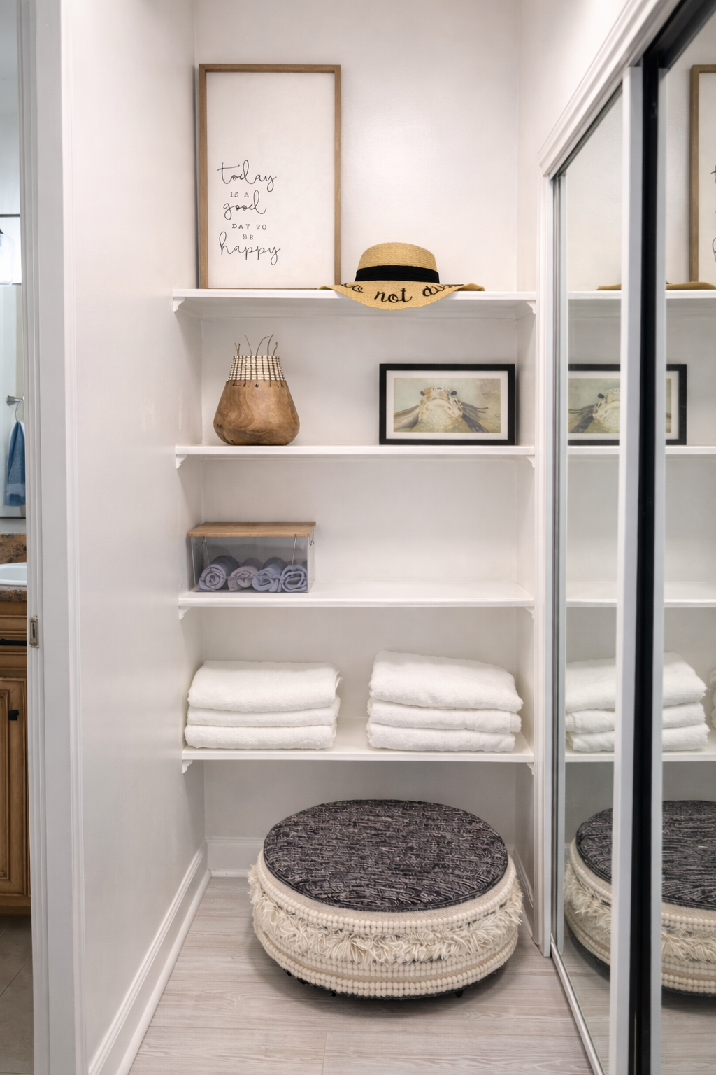 Thoughtfully organized linen closet with plush towels