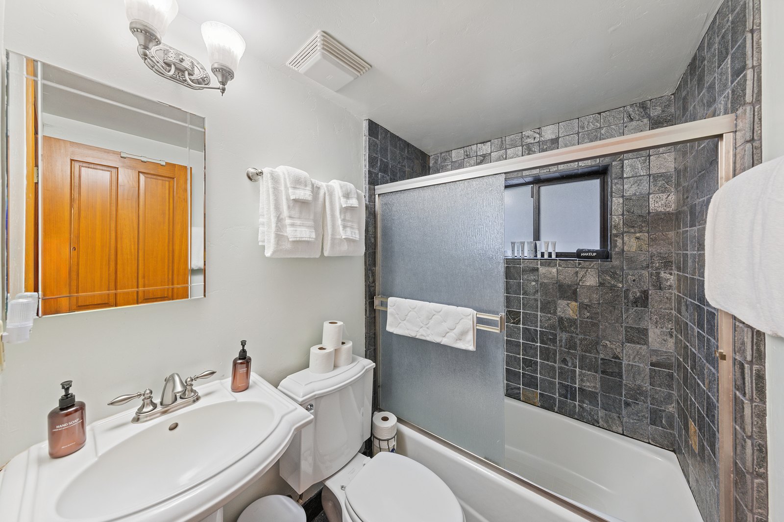 Get the kids scrubbed and the day rinsed off — a full tub-and-shower bath stocked with fresh towels.
