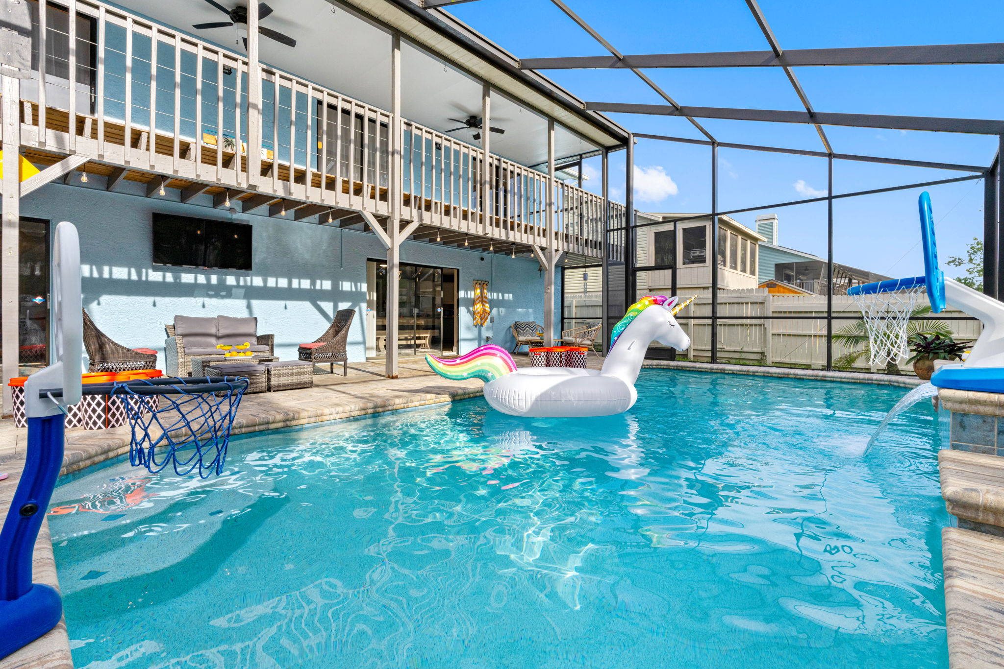 Take a dip in the crystal-clear waters of this inviting pool, framed by elegant paver decking and highlighted by a soothing cascading waterfall.