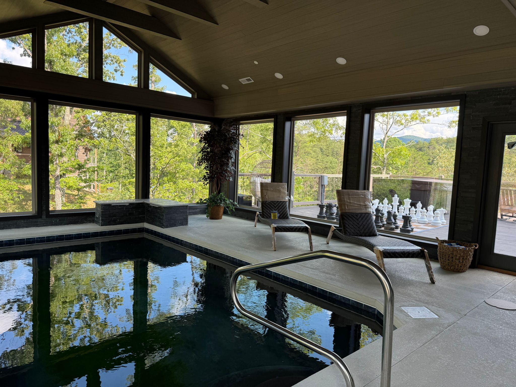 Soak it all in. This sun filled indoor pool opens to sweeping mountain and treetop views, blending spa like calm with nature’s beauty. Lounge poolside, breathe deep, and let the mountains do the rest.