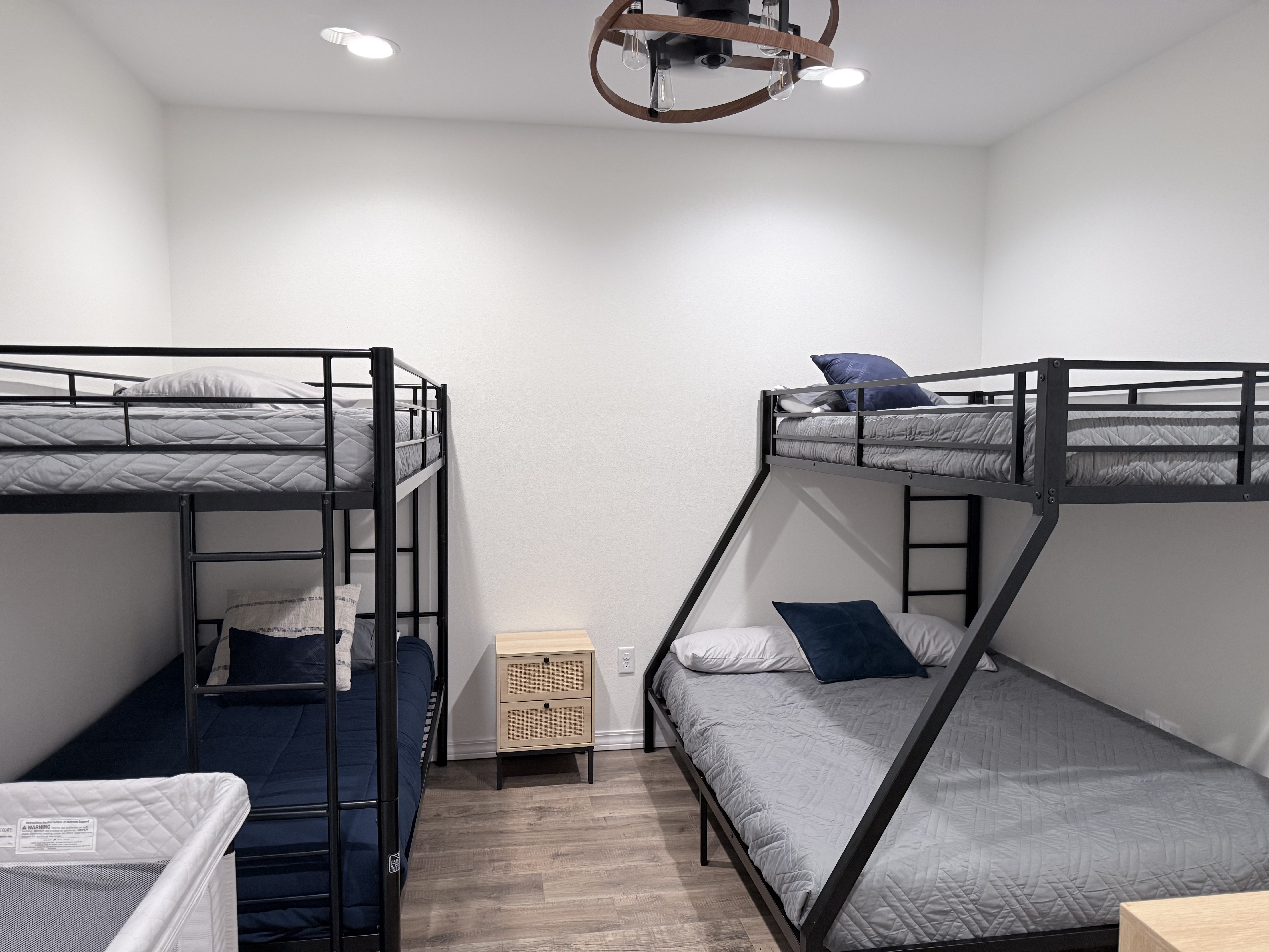 Bunk beds on right is a queen size bed