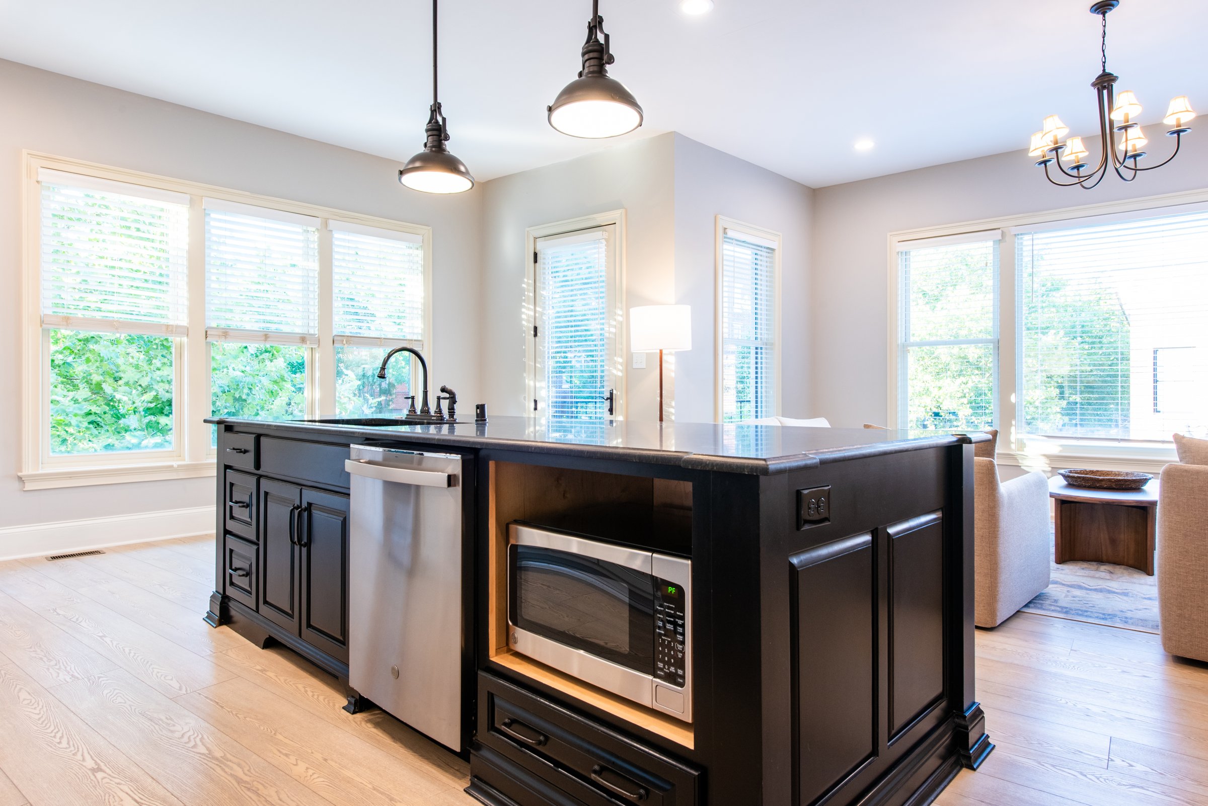 The oversized island seats guests while you cook, with a built-in microwave and dishwasher.