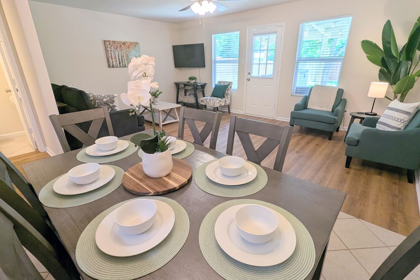 The dining table has comfortable seating for 8 with room to pull up the provided high chair. 