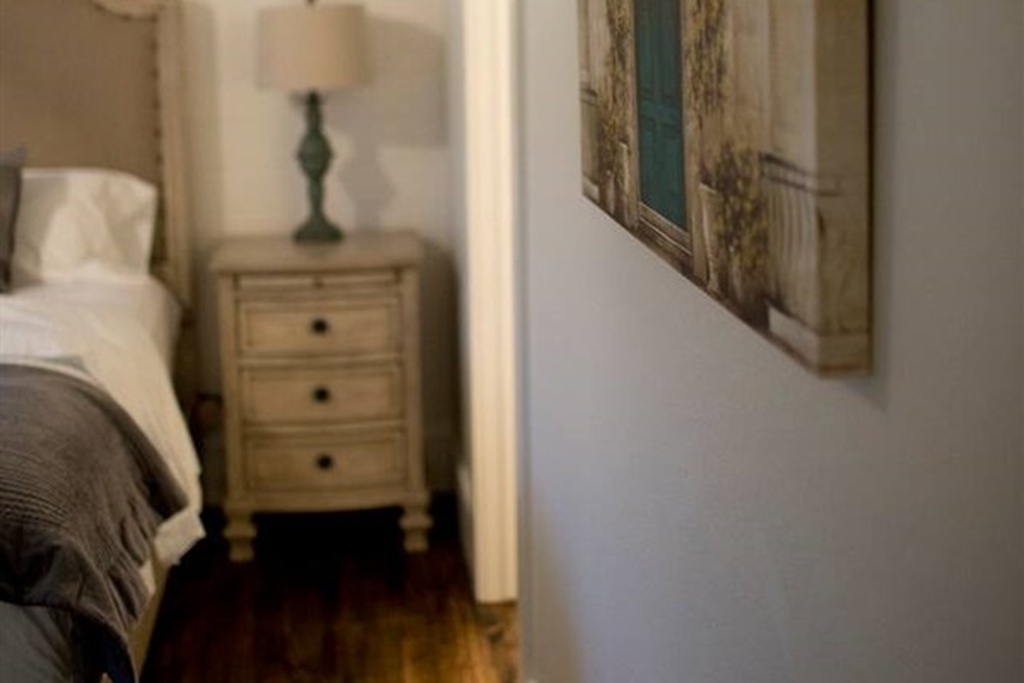 Downstairs bedroom with king bed in arkansas cabin rental
