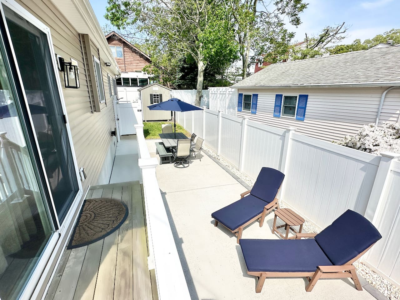 Step right out of the sliding glass doors onto a clean, private patio. This sunny nook is perfect for basking on the lounge chairs or enjoying a snack at the outdoor table. It’s a peaceful, fenced-in spot for some quiet relaxation.
