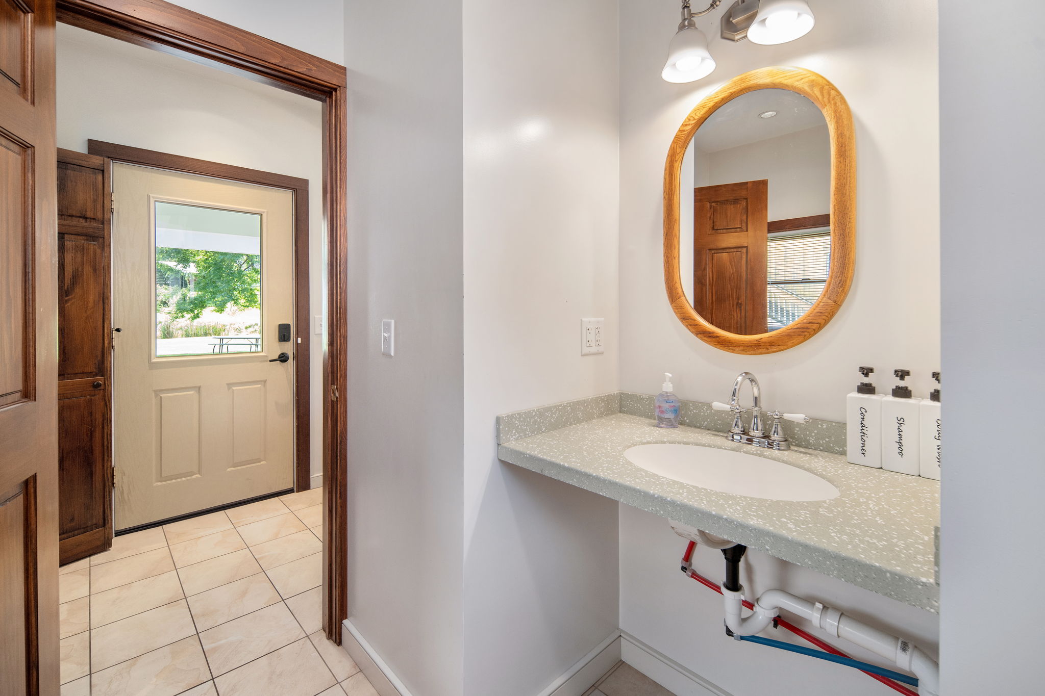 A bright bathroom vanity with space for your everyday essentials.