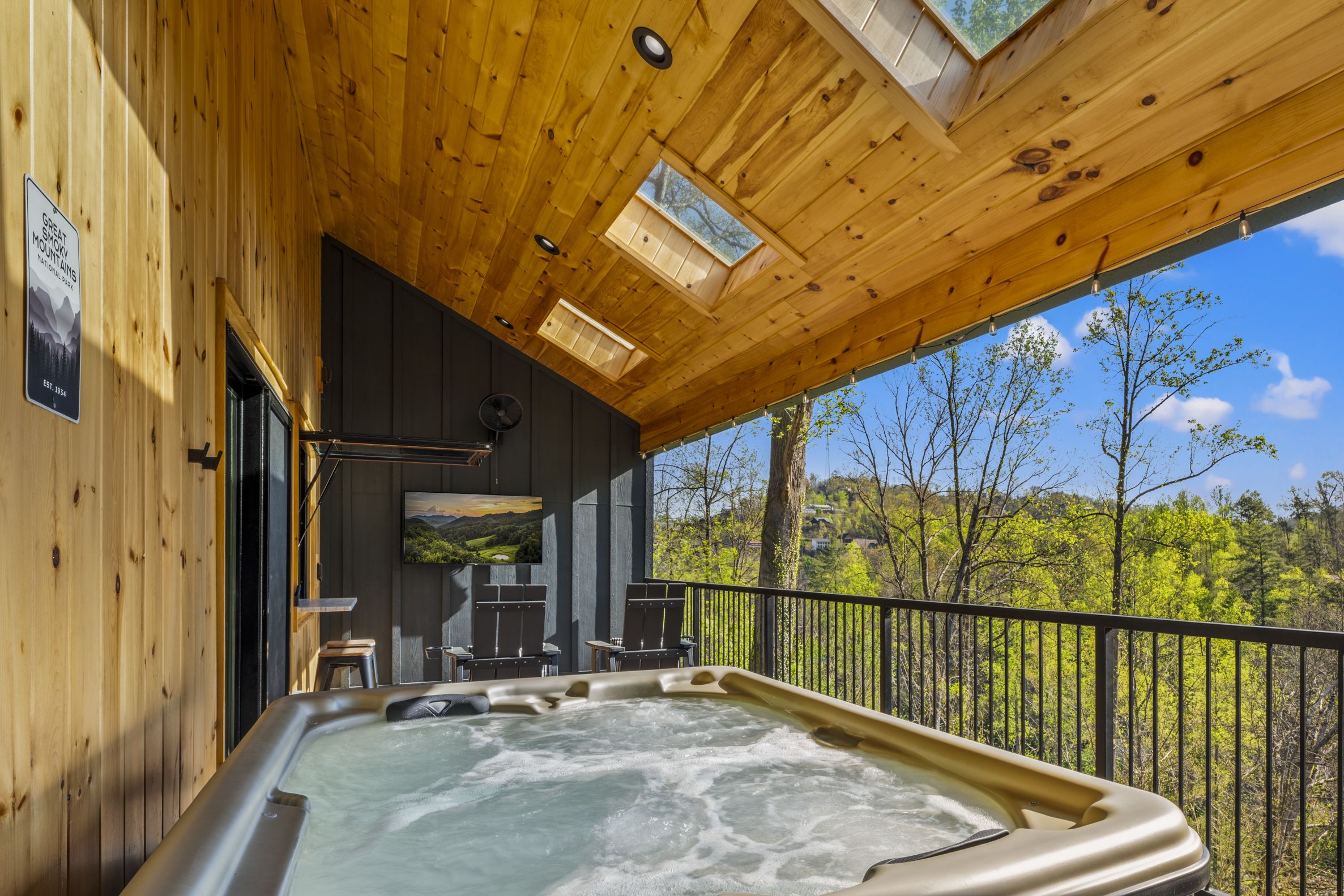 Enjoy a soak in the hot tub while watching TV