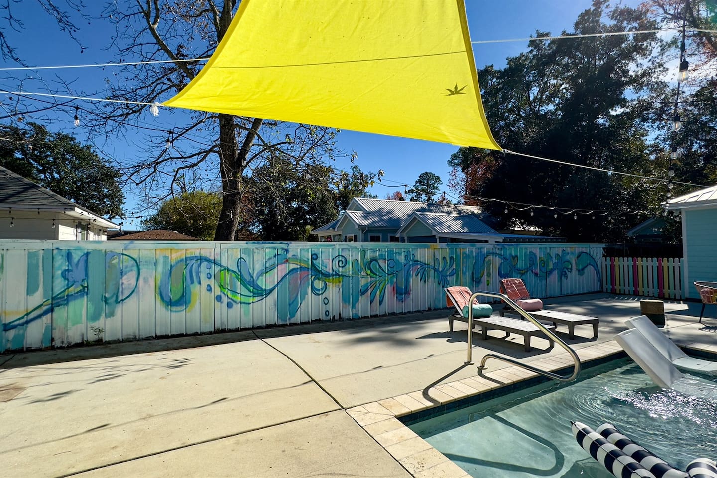 Your backyard escape: shade, swims, and smiles.