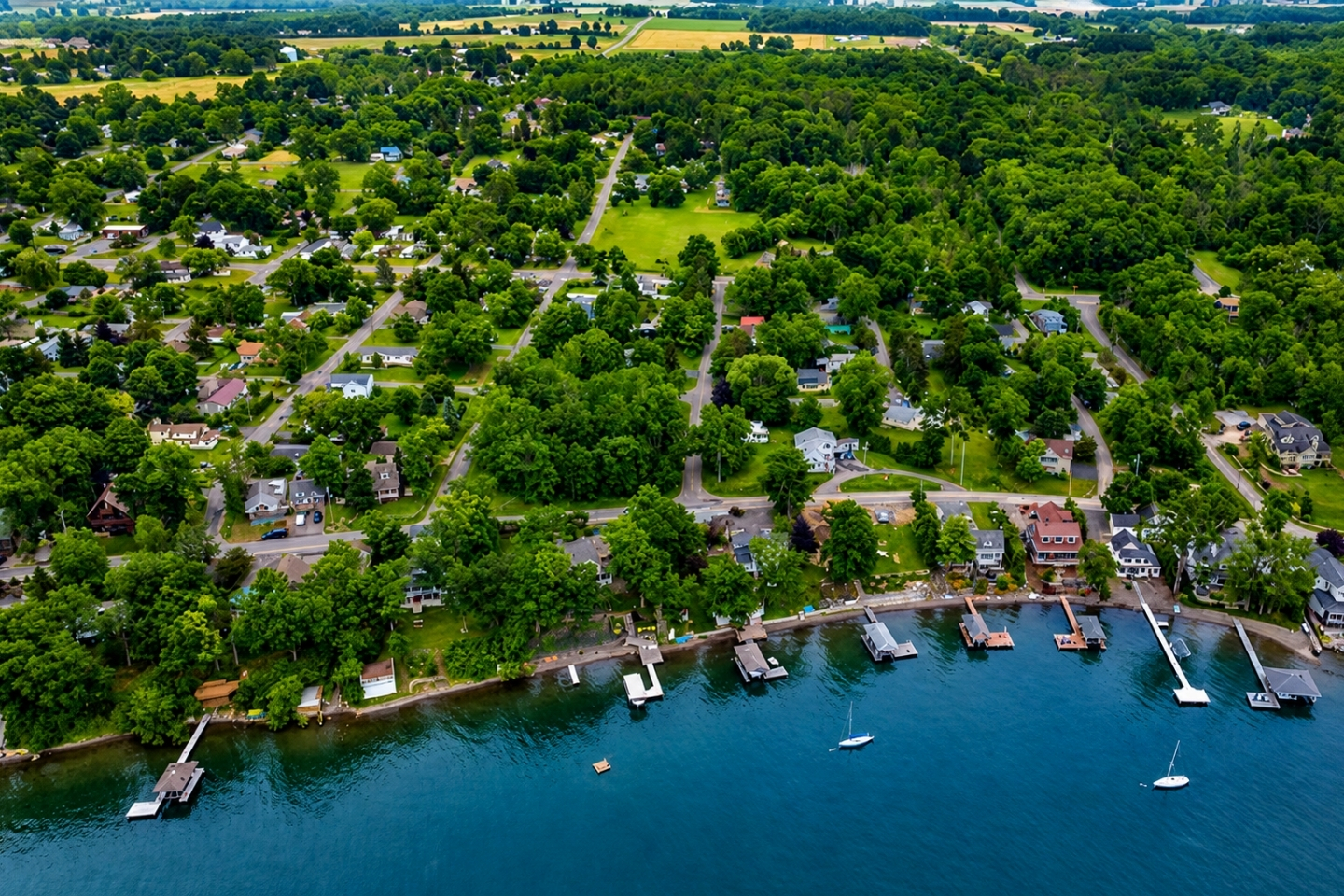 Lakefront paradise with private docks and tree-lined streets—this vibrant community combines waterfront recreation with classic Finger Lakes charm. A dream location for vacationers and locals alike.