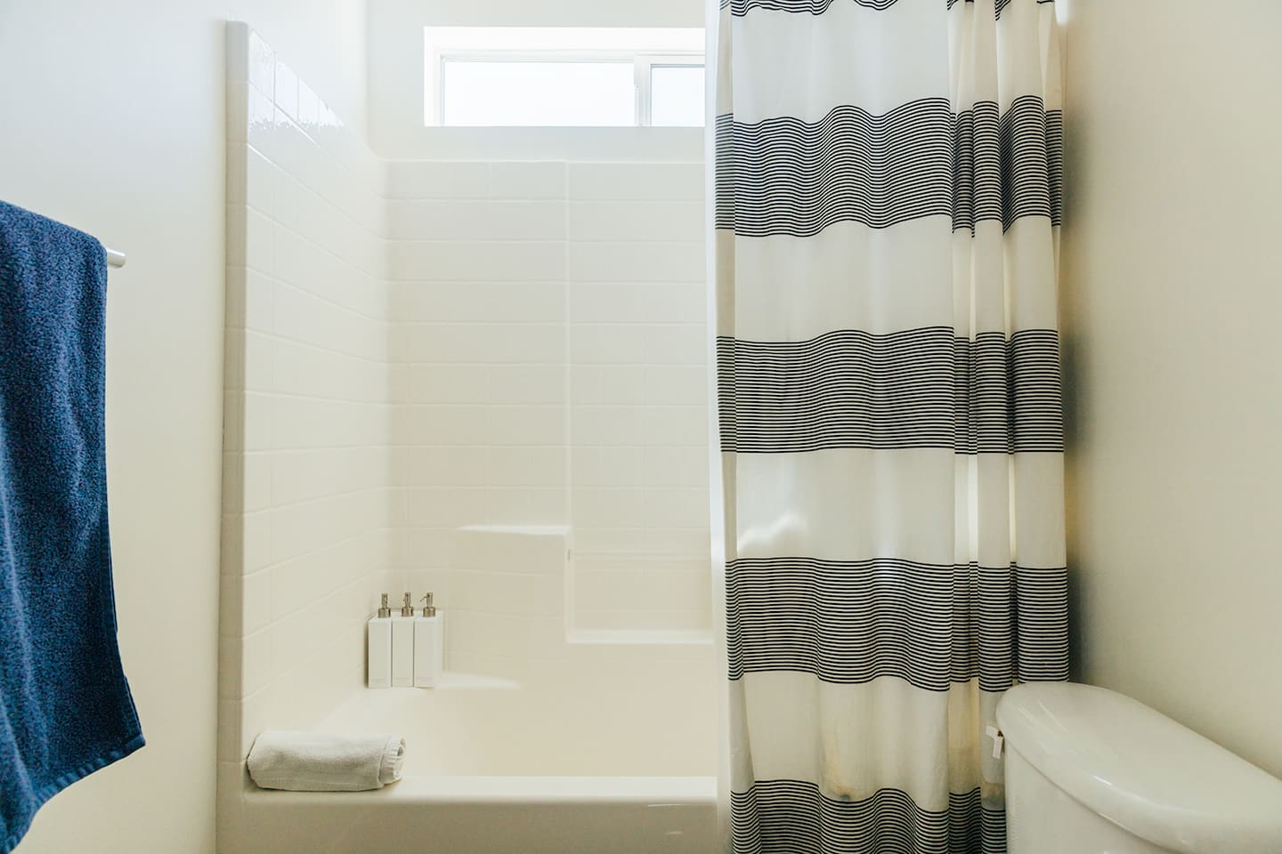 Second Bathroom: Modern bathroom with bathtub complete with shampoo, conditioner and body wash. Private bathroom accessible via "Bedroom 5".