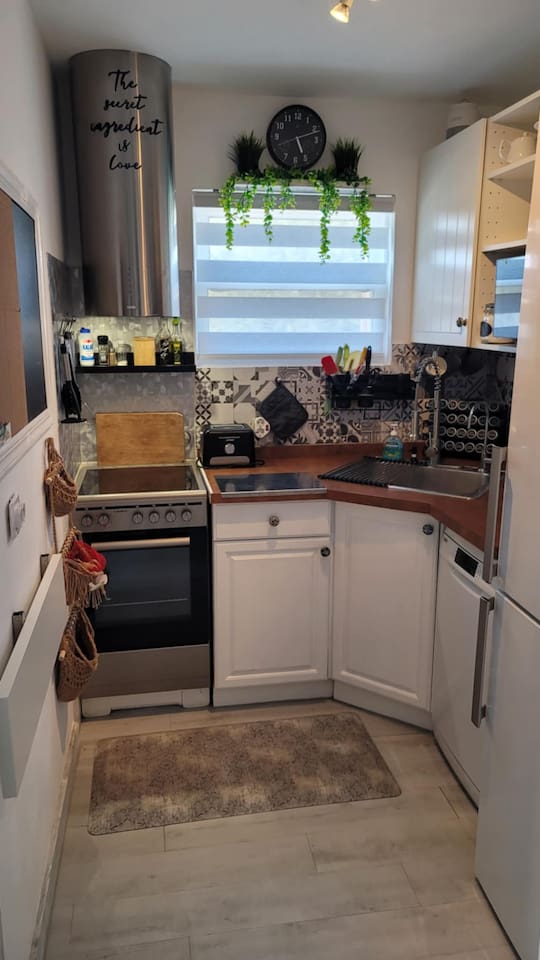 Full kitchen equipped with full size refrigerator, convection oven, 4 burner stovetop, toaster, convection microwave and dishwasher.  Fully stocked with cookware, assorted spices, and cleaning supplies.