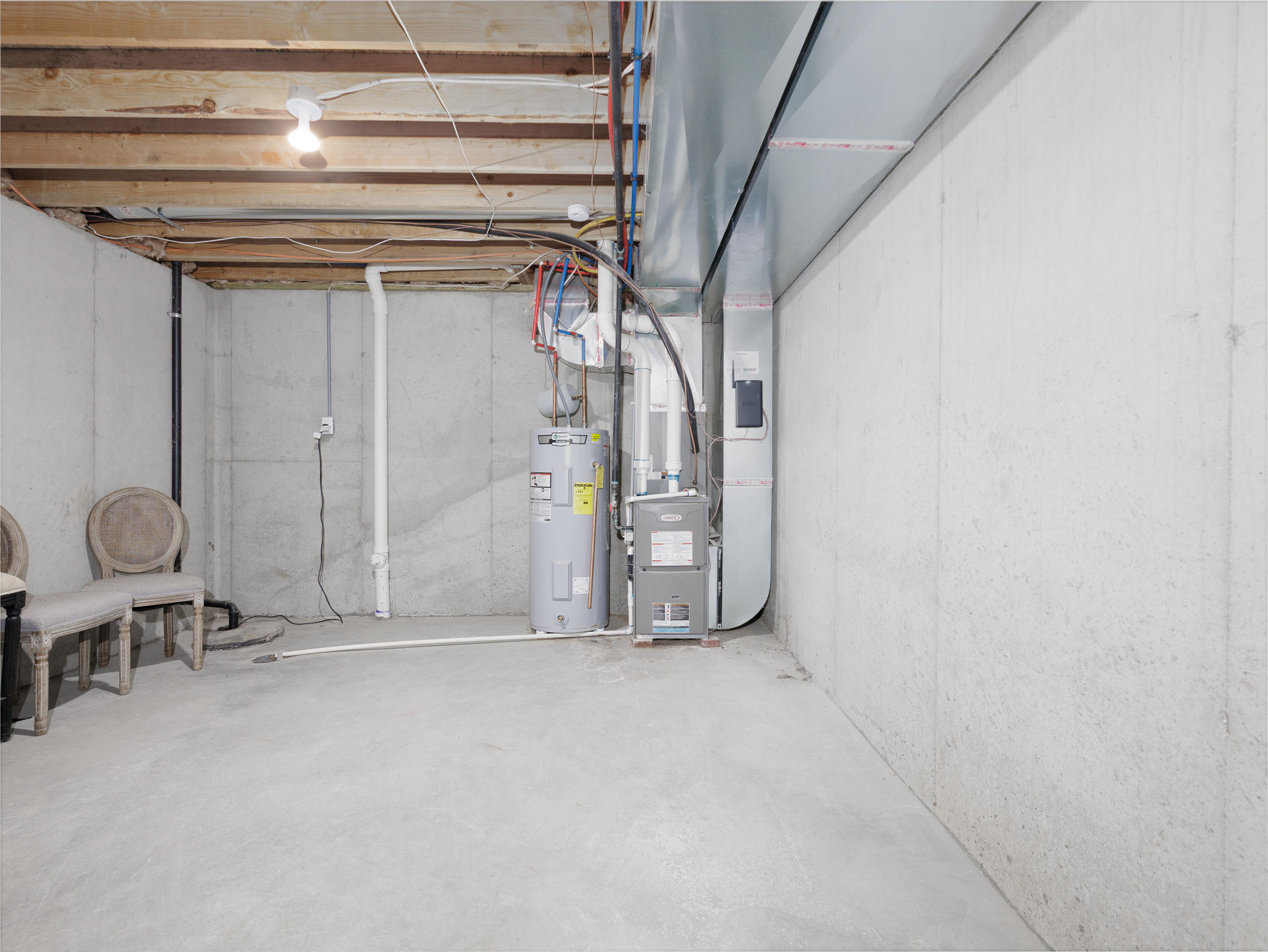 Unfinished basement suitable for storage and utility access
